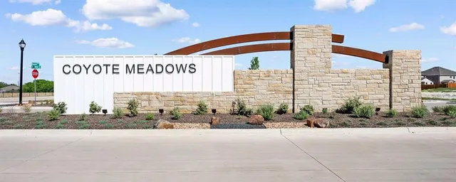 a front view of a building with parking