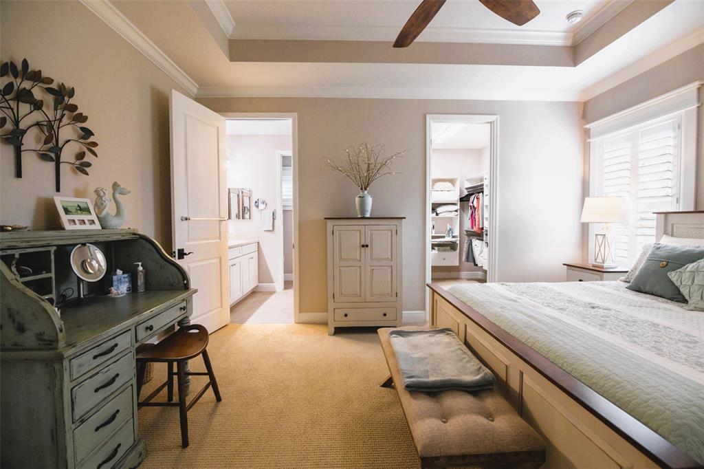 13153 Steinhatchee Loop Venice, FL 34293 - Photo 14 of 33 a bedroom with a bed and a table in it