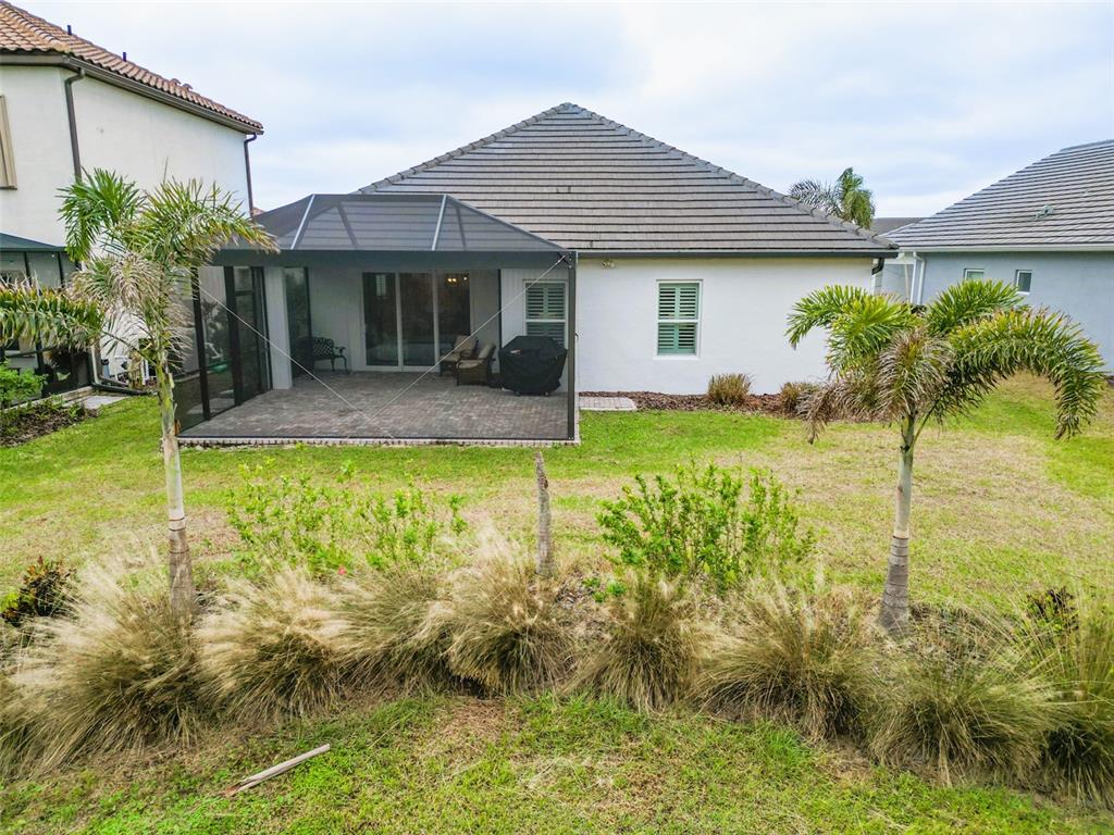 13153 Steinhatchee Loop Venice, FL 34293 - Photo 27 of 33 a view of a house with pool and a garden