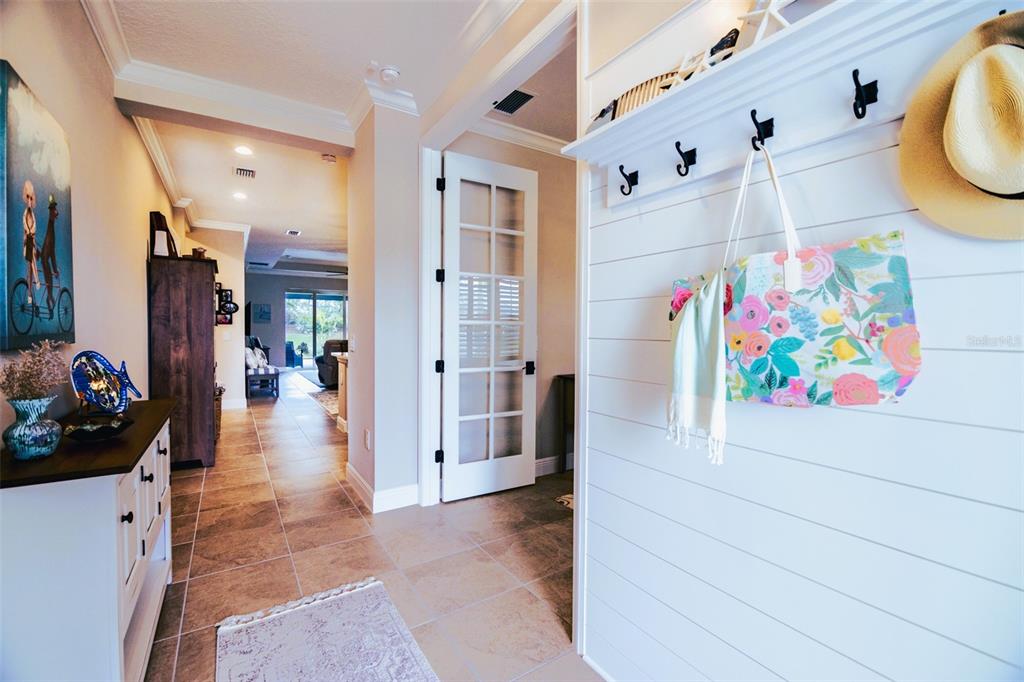 13153 Steinhatchee Loop Venice, FL 34293 - Photo 3 of 33 a hallway with painting and stairs