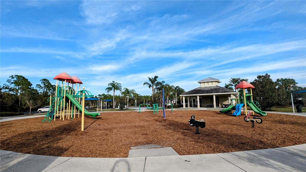 13153 Steinhatchee Loop Venice, FL 34293 - Photo 31 of 33 a view of a park with swings and slides