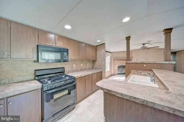 a kitchen with a stove and a sink
