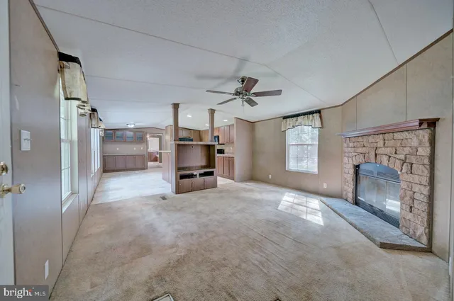 a view of a livingroom with a furniture and a fireplace