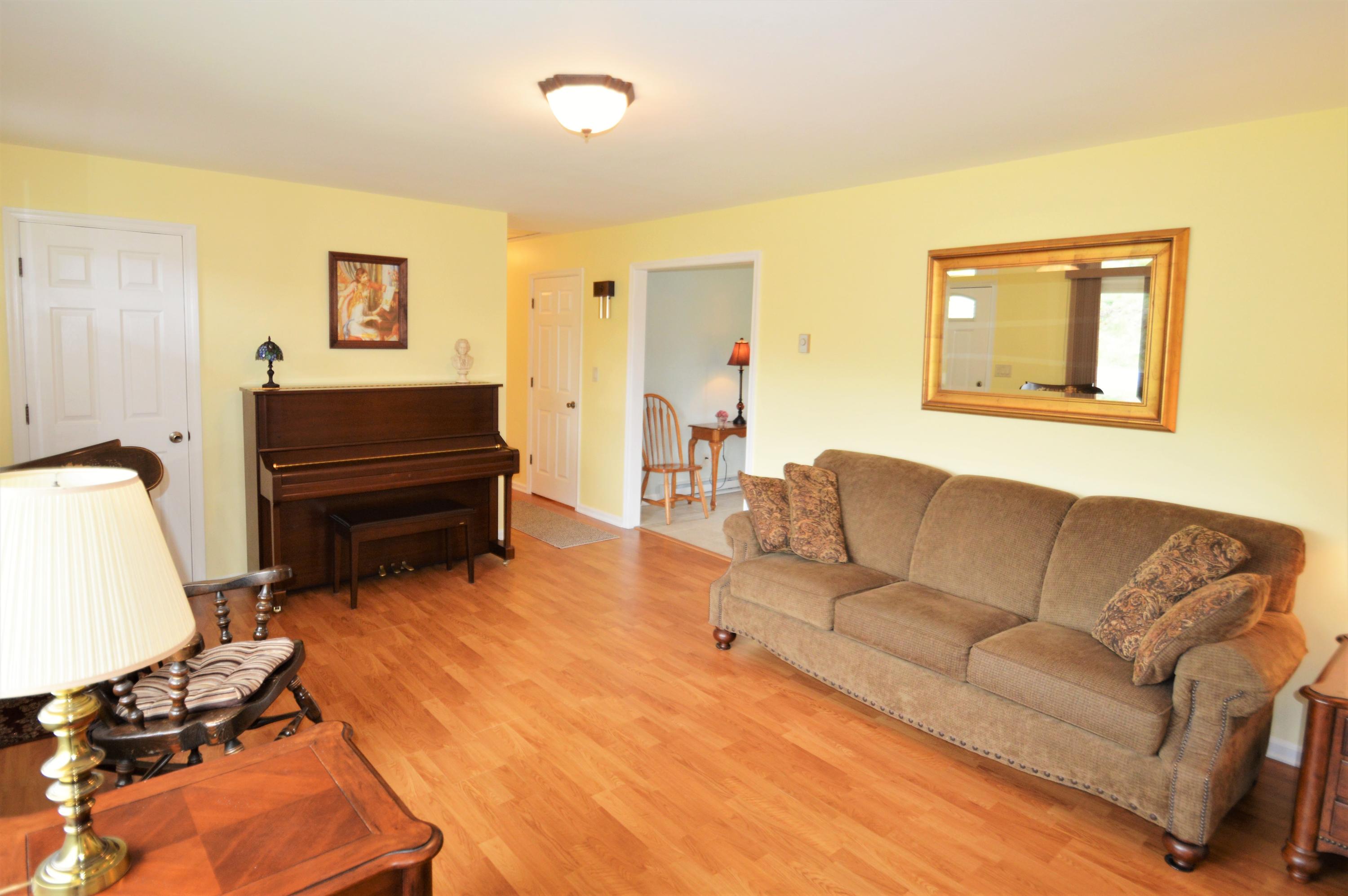 426 Poor Farm Road Southeast Floyd, VA 24091 - Photo 11 of 40 a living room with furniture and a wooden floor