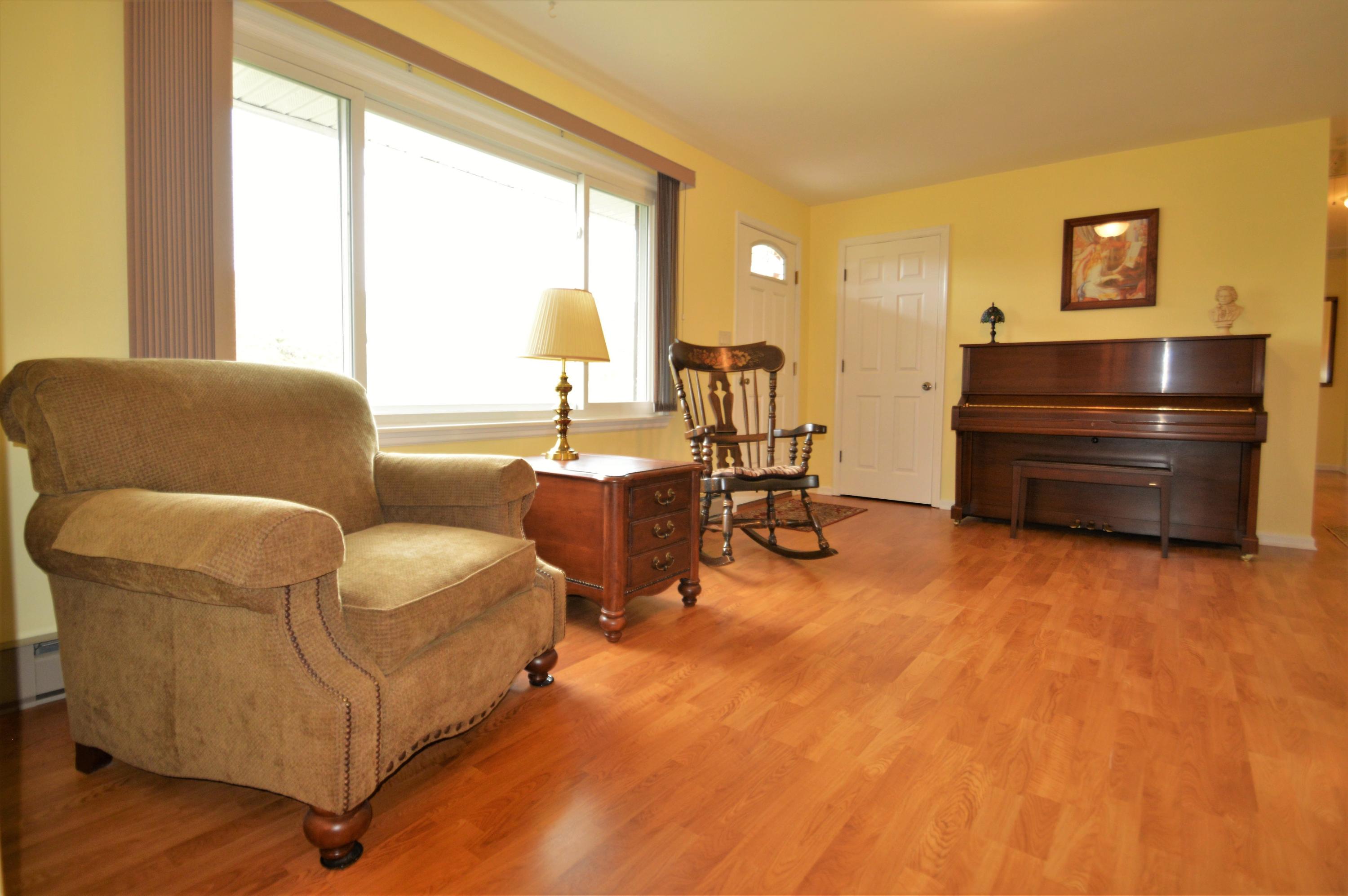 426 Poor Farm Road Southeast Floyd, VA 24091 - Photo 12 of 40 a living room with furniture and a large window