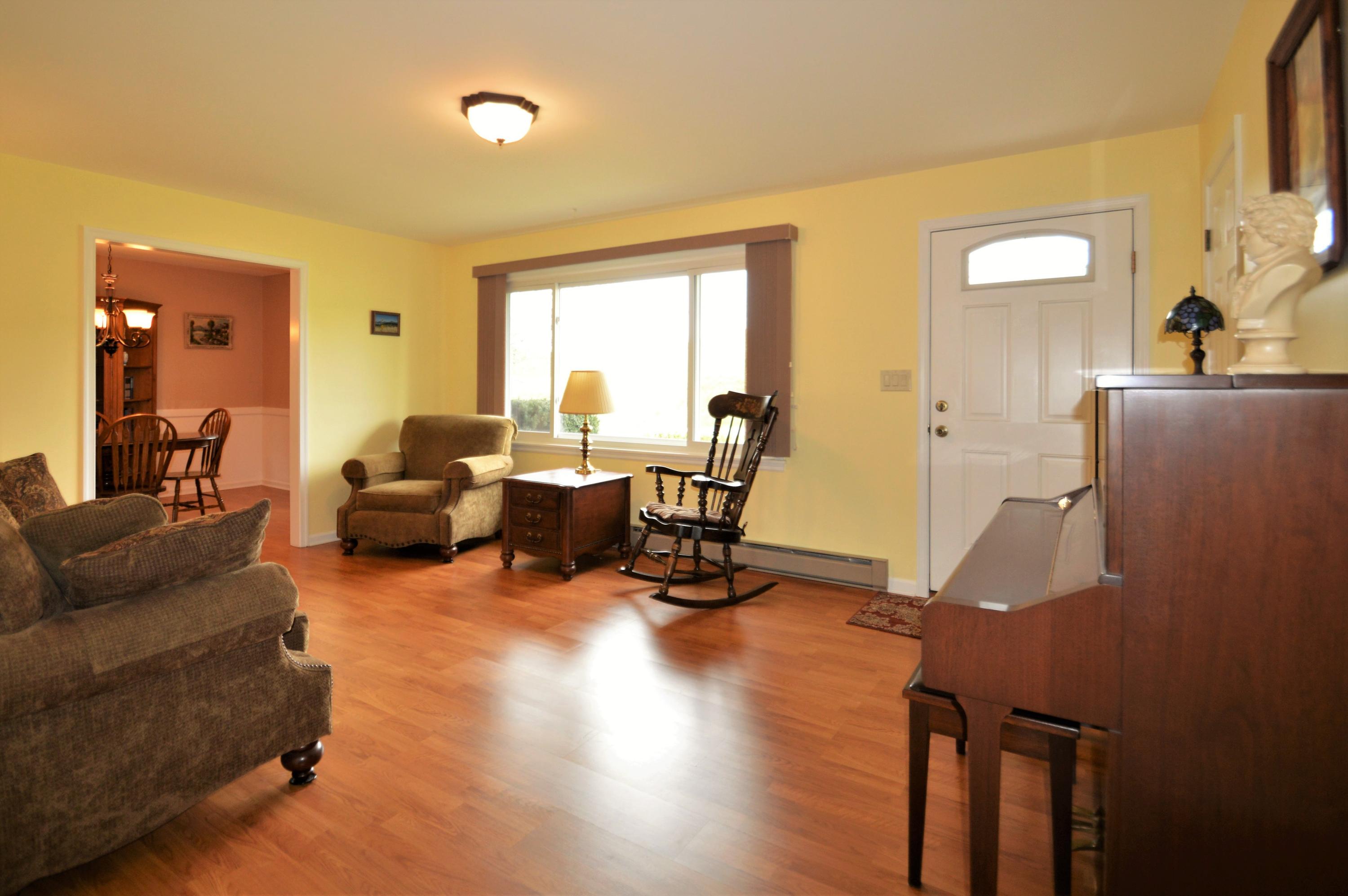 426 Poor Farm Road Southeast Floyd, VA 24091 - Photo 13 of 40 a living room with furniture and a wooden floor