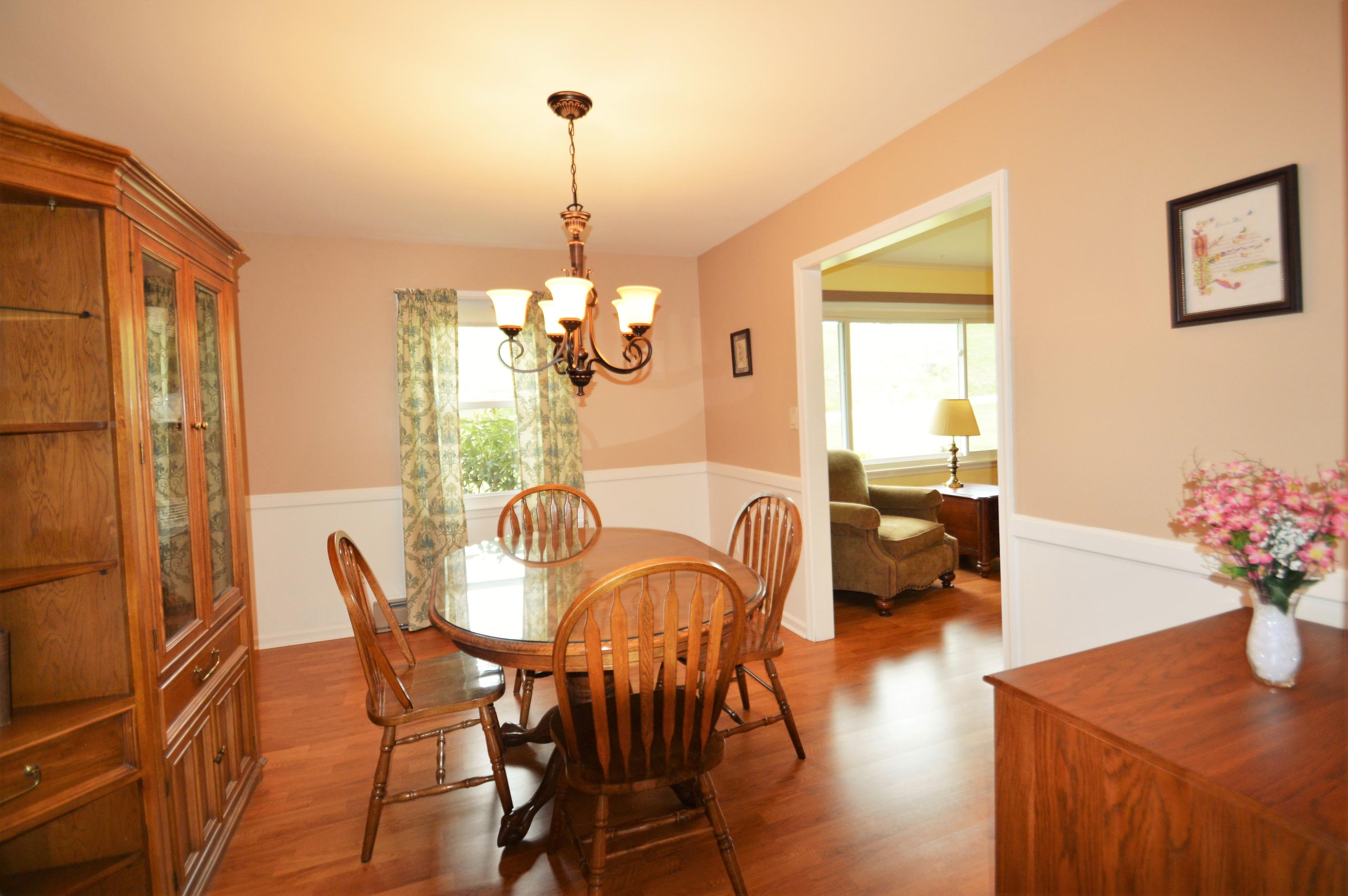 426 Poor Farm Road Southeast Floyd, VA 24091 - Photo 14 of 40 a view of a dining room with furniture window and wooden floor