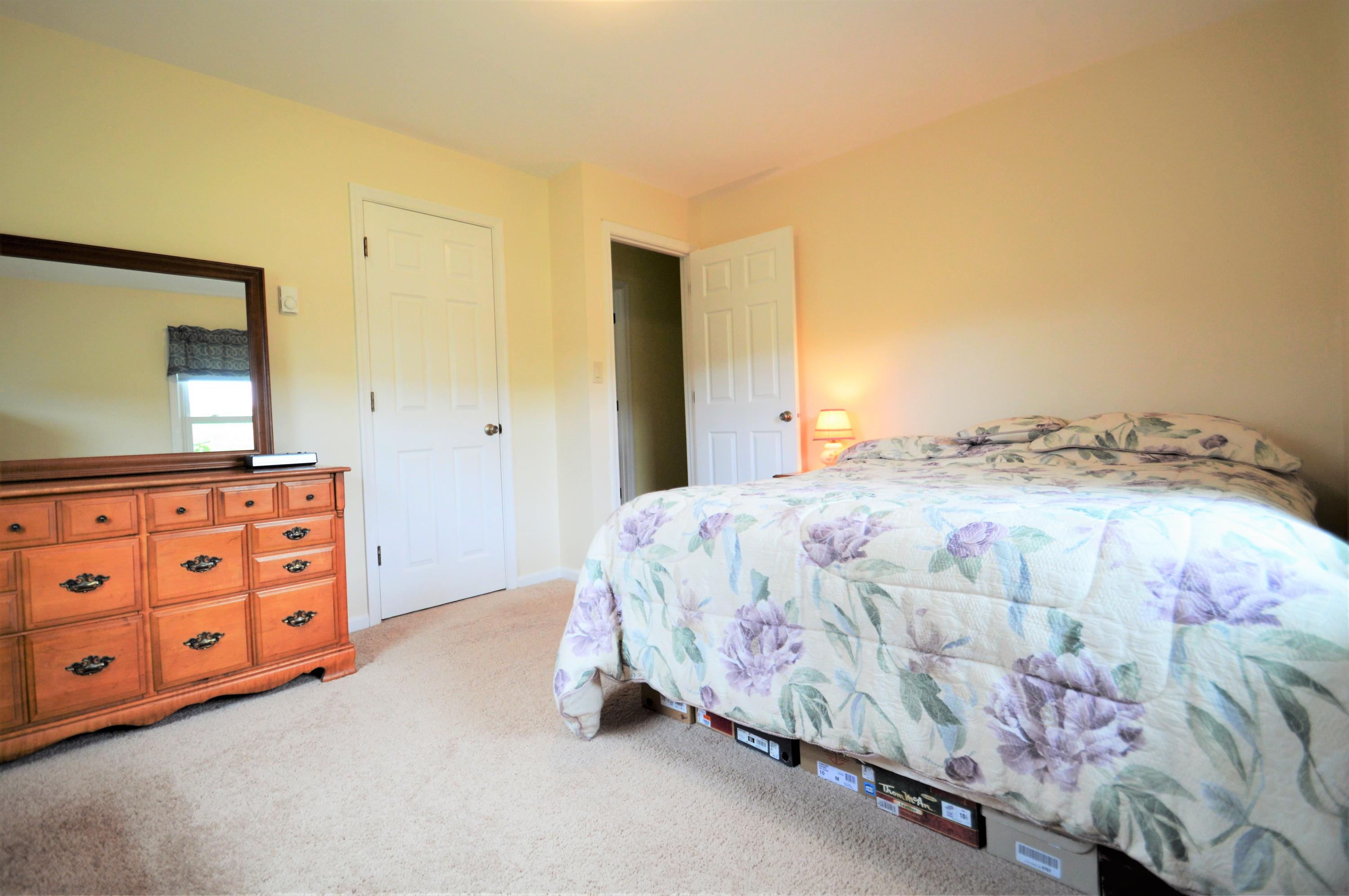 426 Poor Farm Road Southeast Floyd, VA 24091 - Photo 20 of 40 a bedroom with a bed and a dresser in it