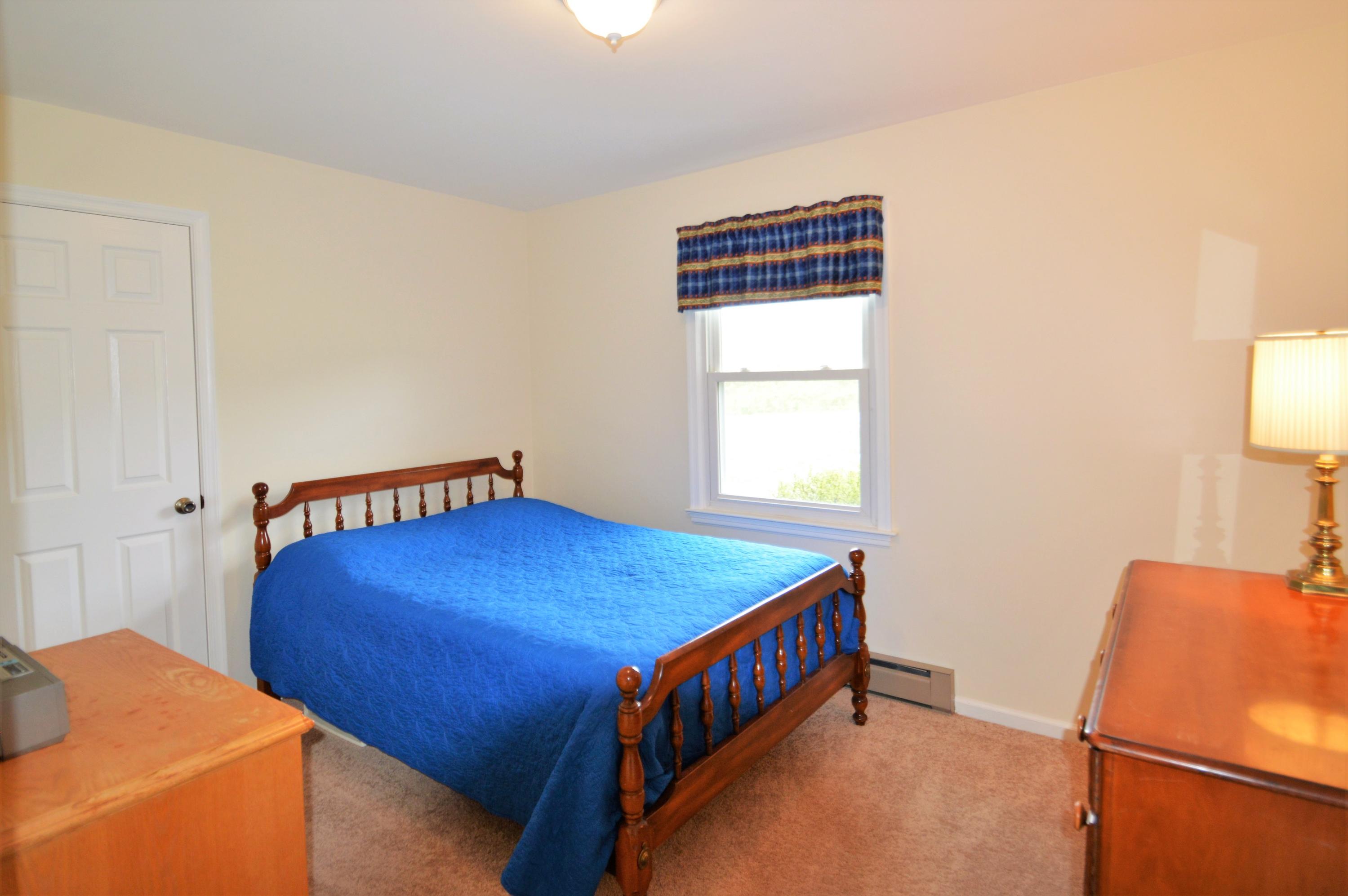 426 Poor Farm Road Southeast Floyd, VA 24091 - Photo 21 of 40 a bedroom with a bed and a window