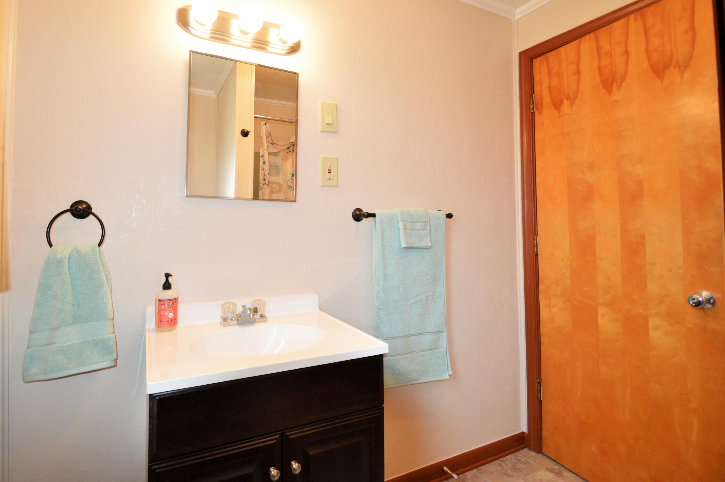 426 Poor Farm Road Southeast Floyd, VA 24091 - Photo 23 of 40 a bathroom with a sink and mirror