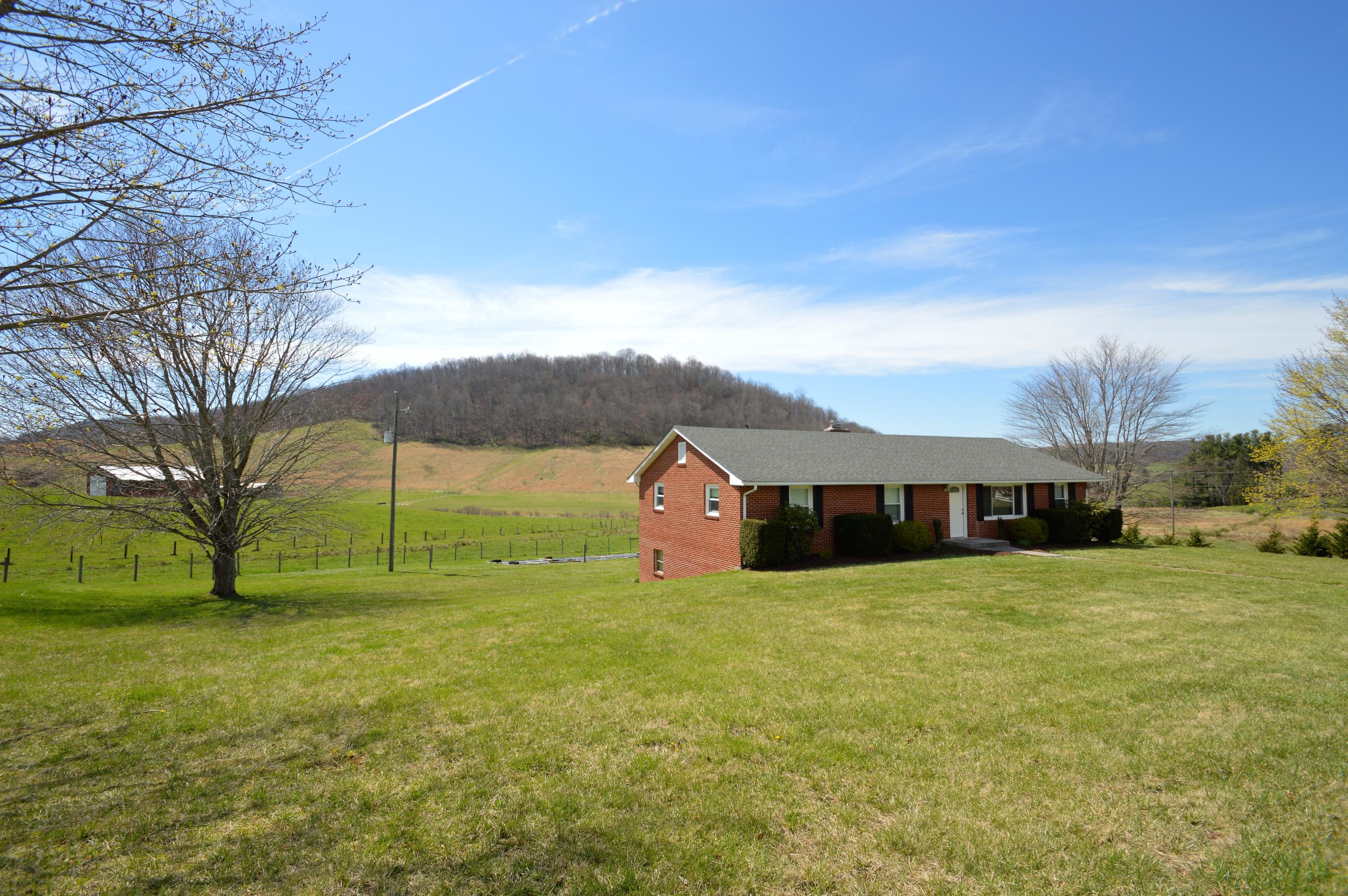426 Poor Farm Road Southeast Floyd, VA 24091 - Photo 5 of 40 a view of a house with a yard