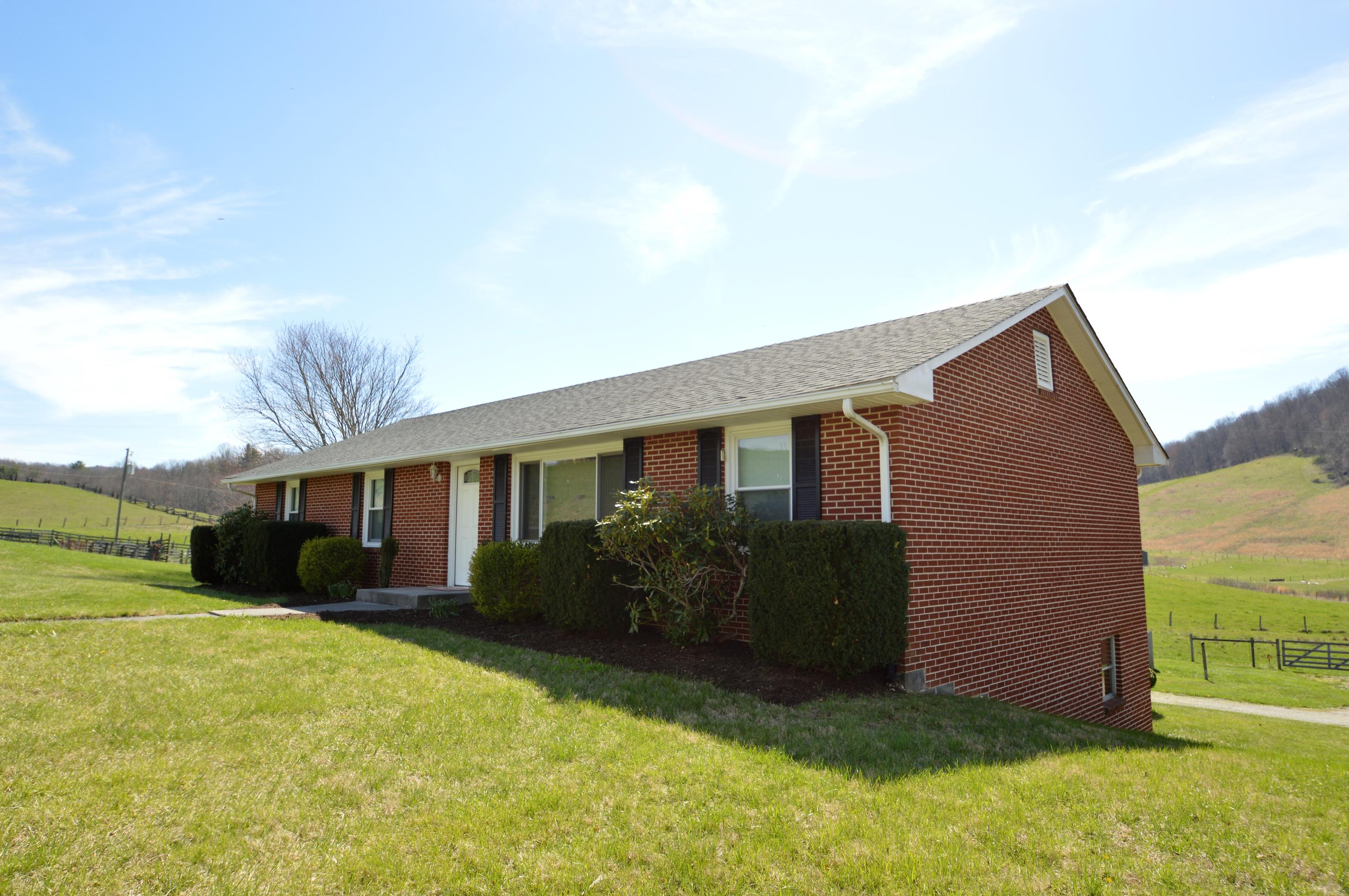 426 Poor Farm Road Southeast Floyd, VA 24091 - Photo 6 of 40 a view of a house with yard and a garden