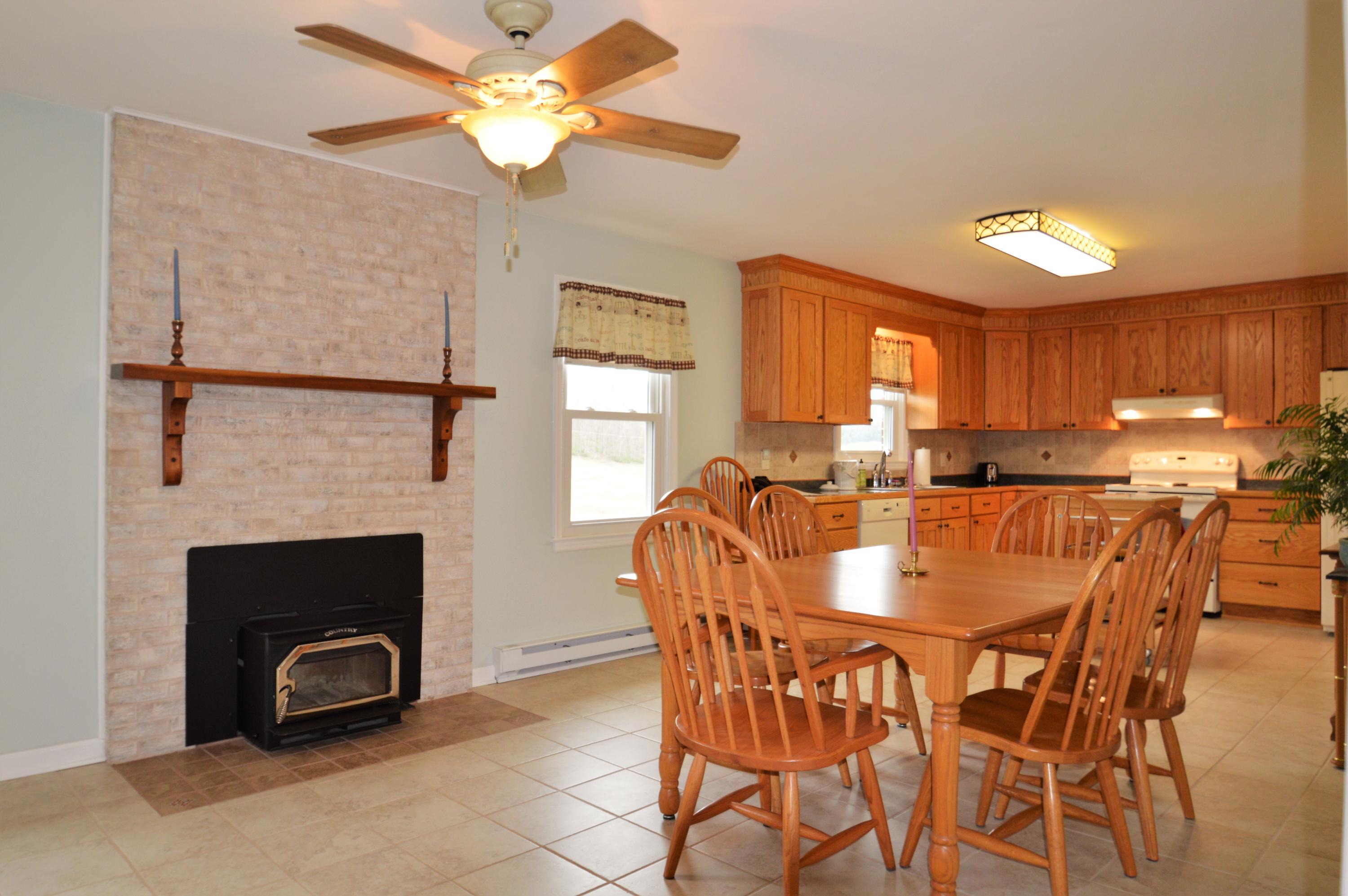426 Poor Farm Road Southeast Floyd, VA 24091 - Photo 10 of 40 a view of a dining room with furniture and a fireplace
