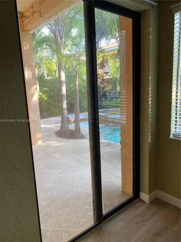 a view of a glass door with a porch