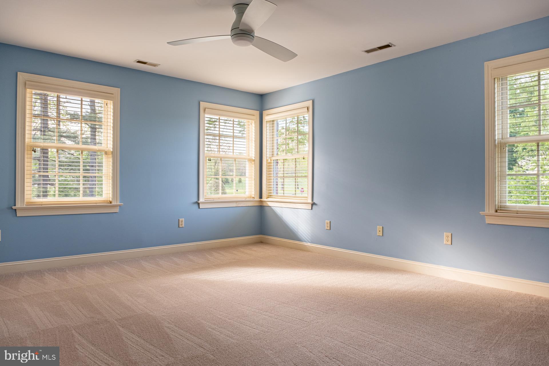 2 Garden Path, Unit 14 Doylestown, PA 18901 - Photo 23 of 36 Bright and airy blue room with windows.