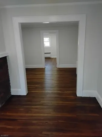 a view of room with wooden floor