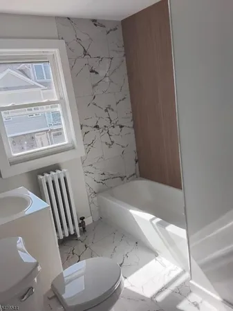 a bathroom with a sink and a toilet