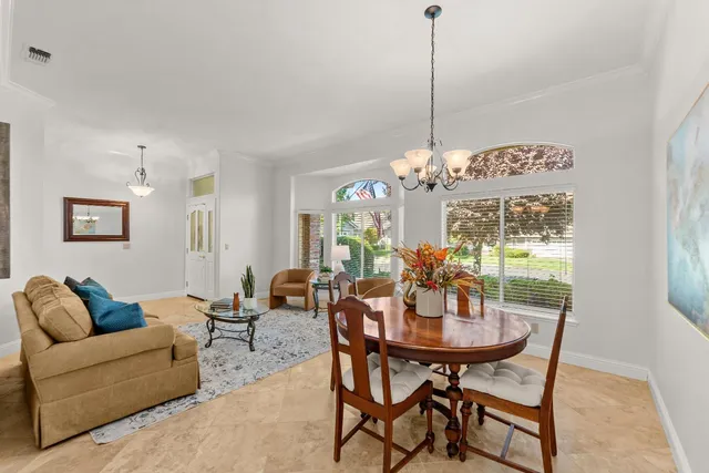 a view of a dining room with furniture window and outside view