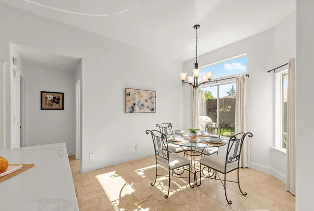 a dining room with furniture and window