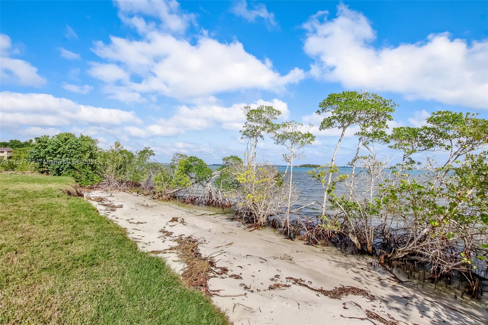 148-150 South Sewalls Point Road Stuart, FL 34996 - Photo 17 of 59 a view of a pathway with a yard