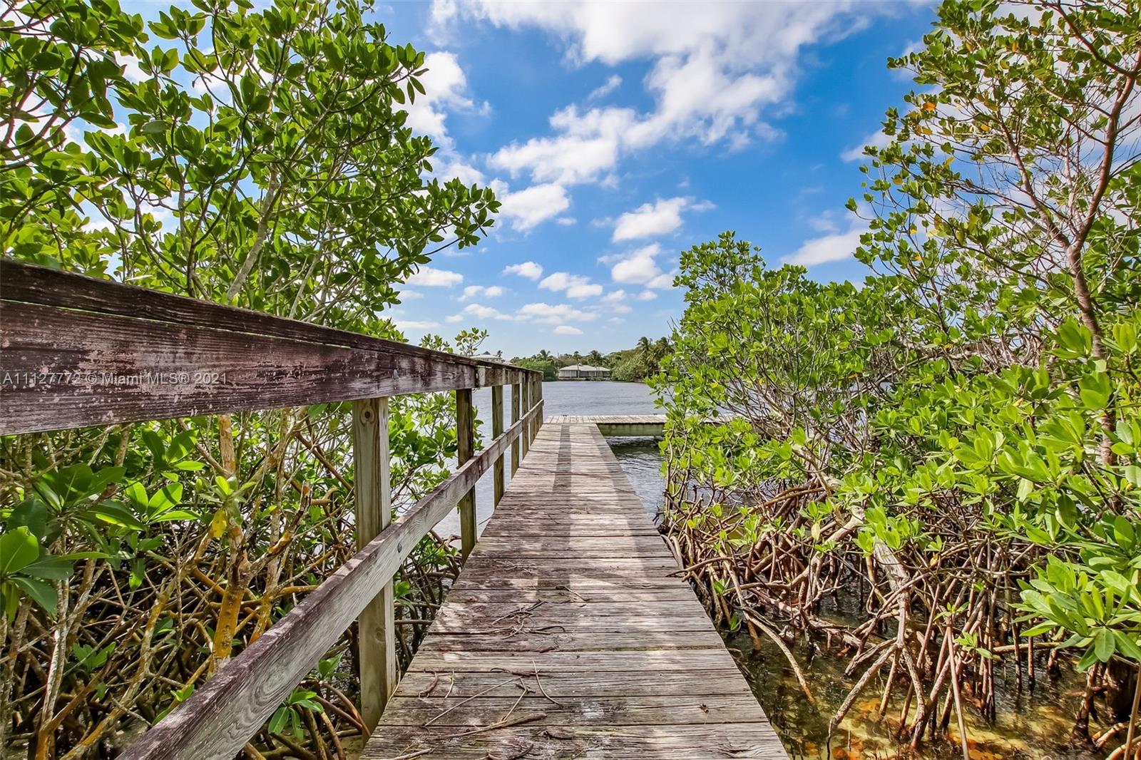 148-150 South Sewalls Point Road Stuart, FL 34996 - Photo 20 of 59 a view of a pathway with a garden