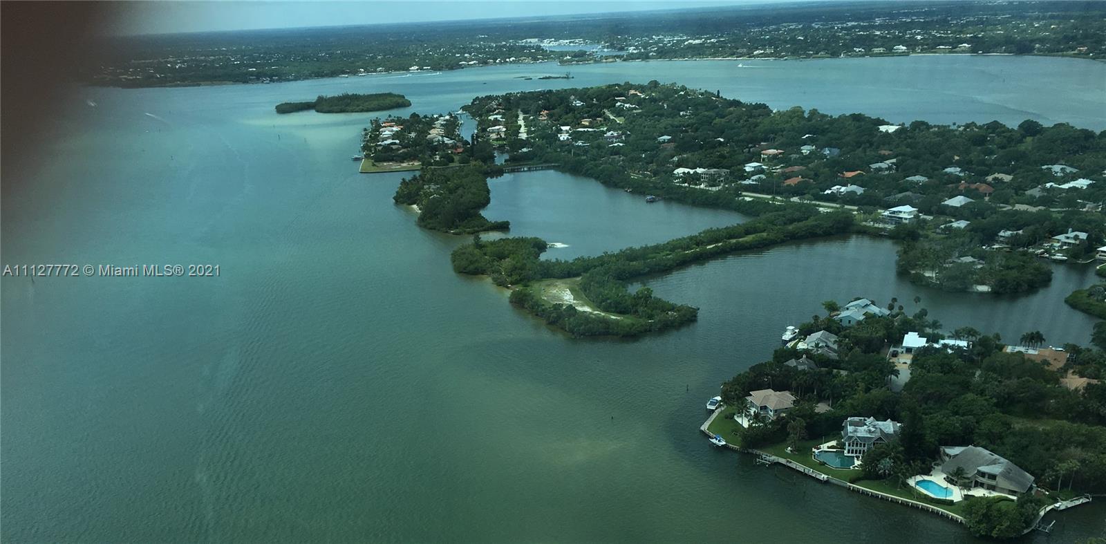 148-150 South Sewalls Point Road Stuart, FL 34996 - Photo 3 of 59 view of lake with green space