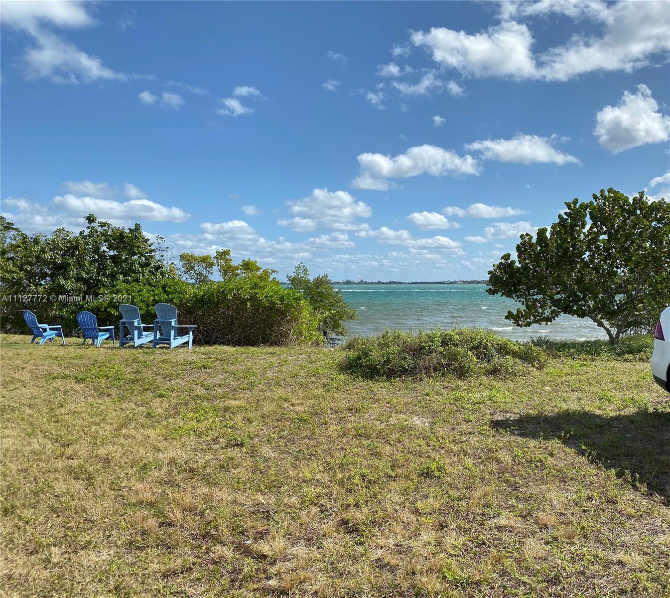 148-150 South Sewalls Point Road Stuart, FL 34996 - Photo 44 of 59 a view of a yard with an tree