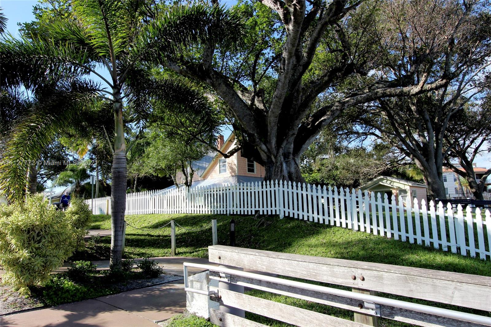 148-150 South Sewalls Point Road Stuart, FL 34996 - Photo 52 of 59 a view of a bench in a garden