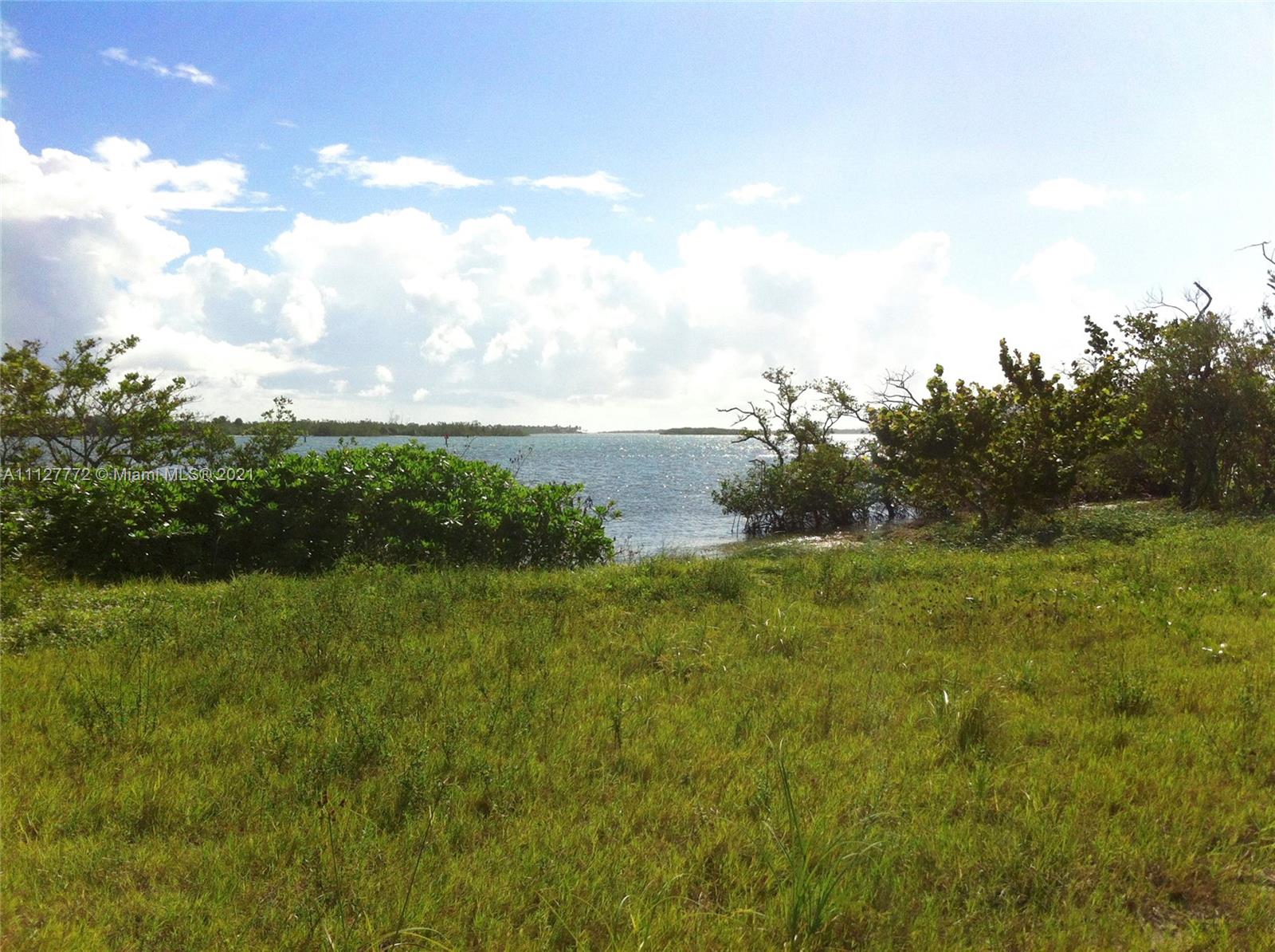 148-150 South Sewalls Point Road Stuart, FL 34996 - Photo 57 of 59 a view of a field of grass and trees