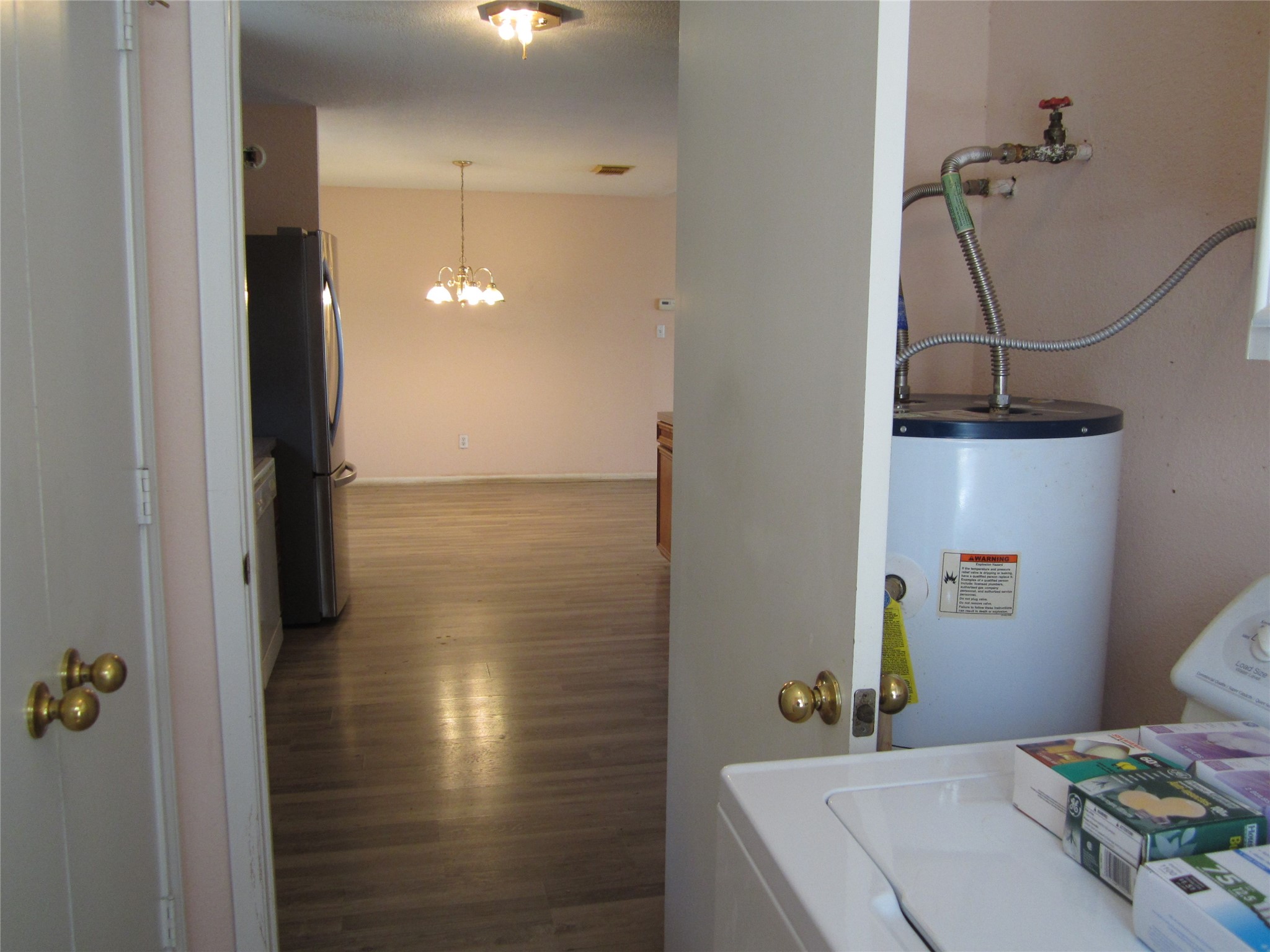 20697 Pierceall Road Hempstead, TX 77445 - Photo 12 of 35 This photo shows a utility area with a water heater and pantry.