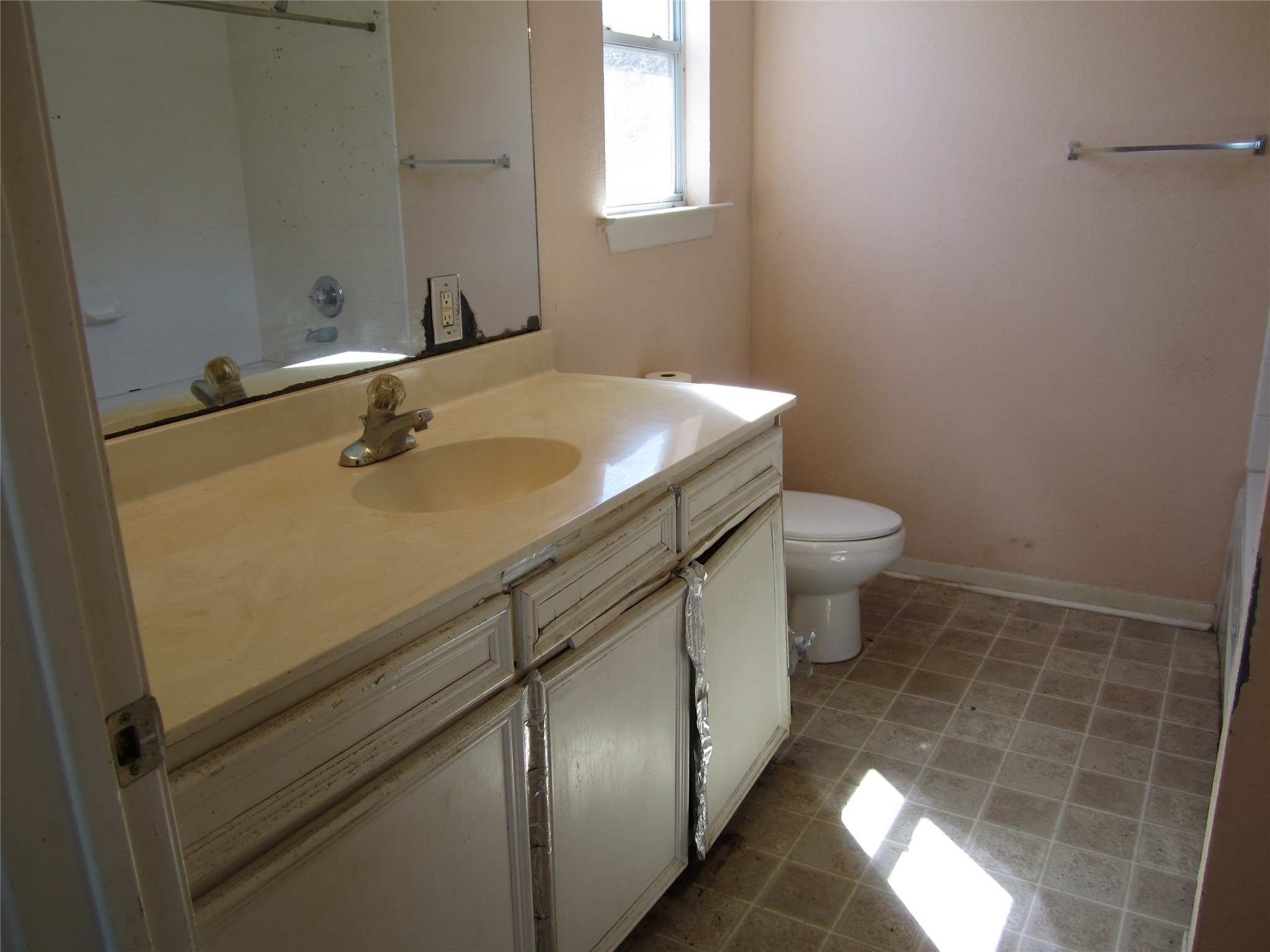 20697 Pierceall Road Hempstead, TX 77445 - Photo 20 of 35 This is the primary bathroom. It needs some TLC repairs. There was a leak under the vanity that has been repaired but the vanity needs work.