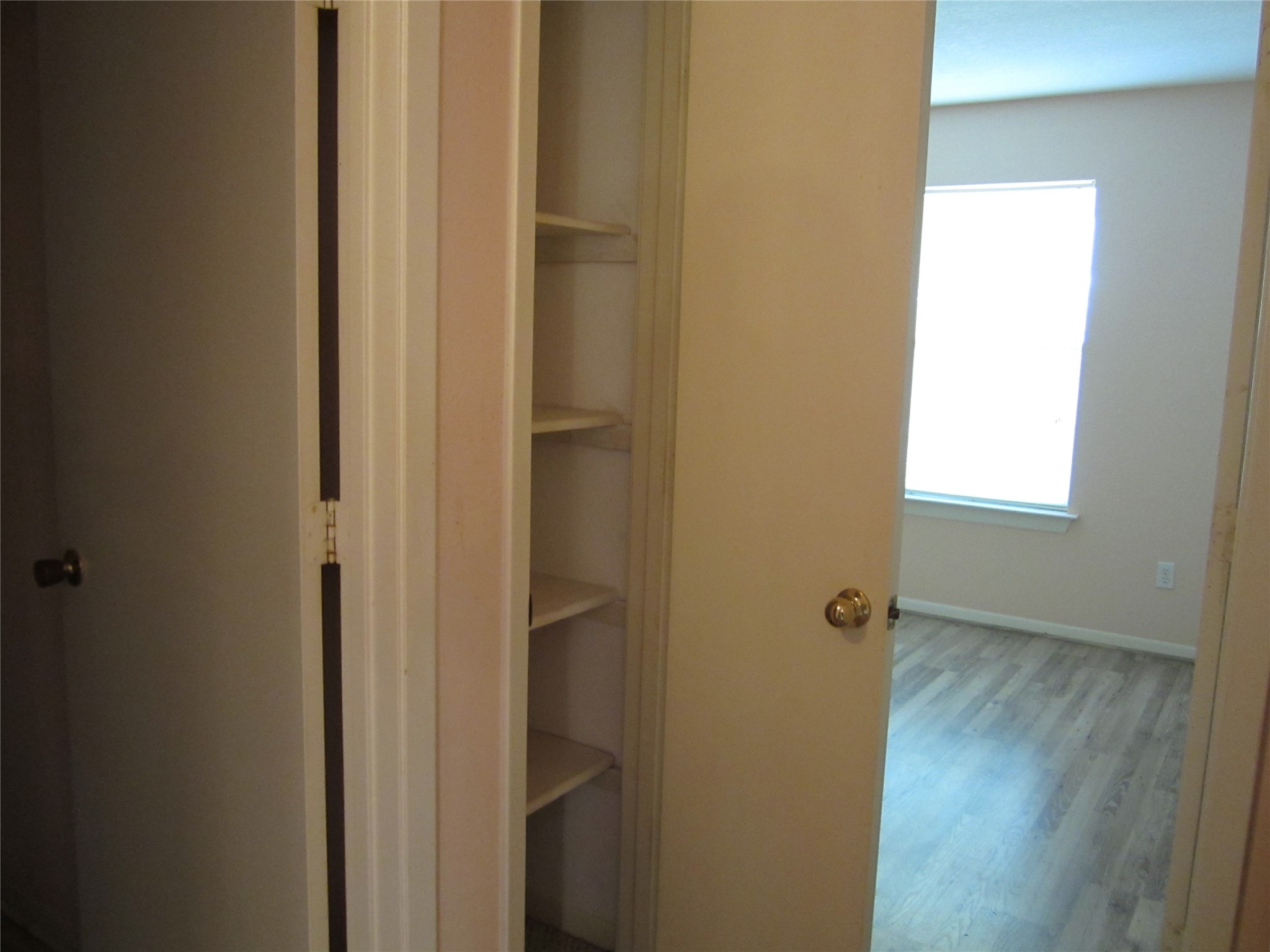 20697 Pierceall Road Hempstead, TX 77445 - Photo 29 of 35 Hallway also offers a linen closet featuring built-in shelves.