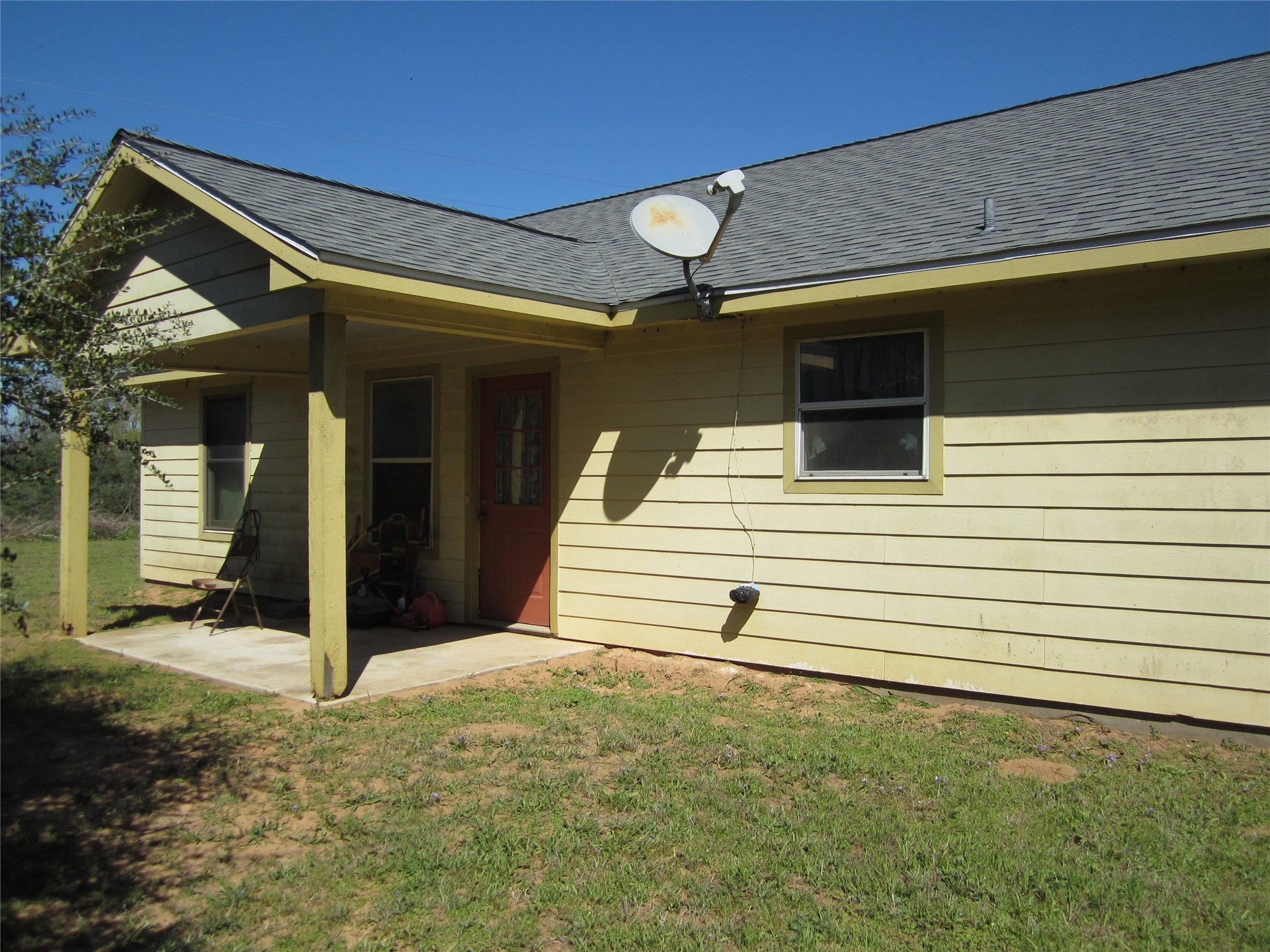 20697 Pierceall Road Hempstead, TX 77445 - Photo 33 of 35 Another look at the back porch. Big enough for your grill and to relax on in private after a hard days work.