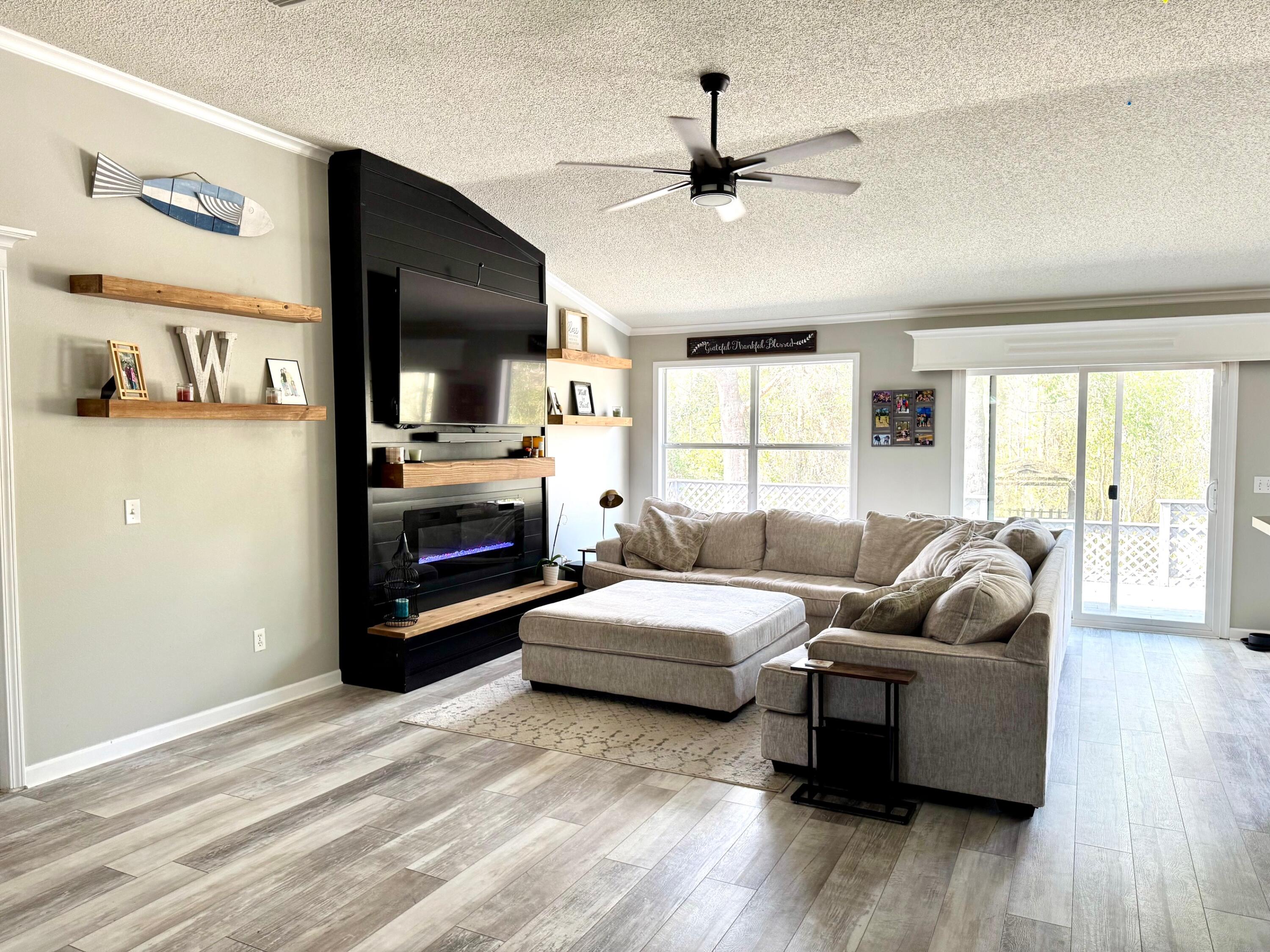 318 Peggy Drive Crestview, FL 32536 - Photo 11 of 47 a living room with furniture and a fireplace
