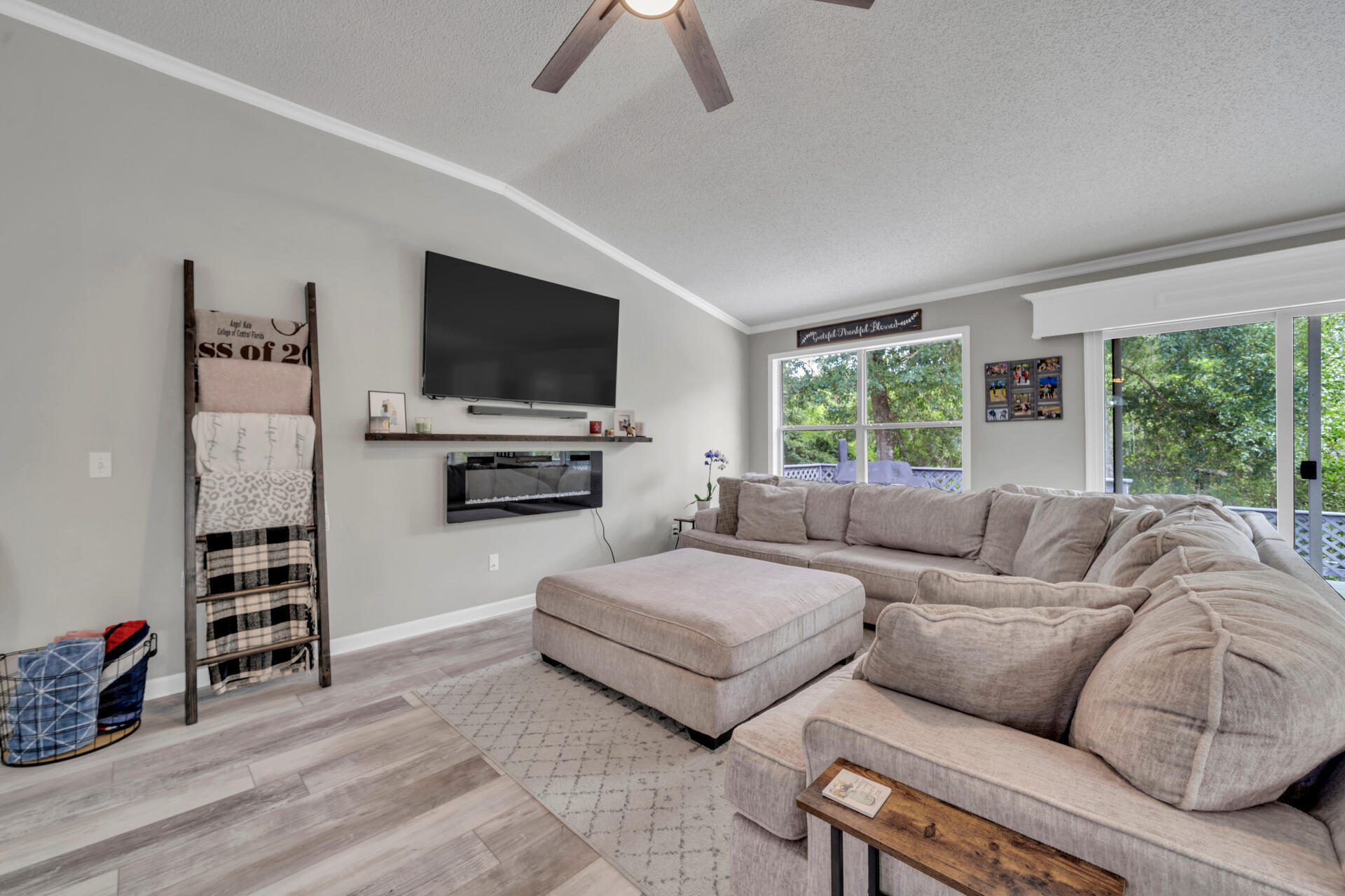318 Peggy Drive Crestview, FL 32536 - Photo 13 of 47 a living room with furniture and a flat screen tv