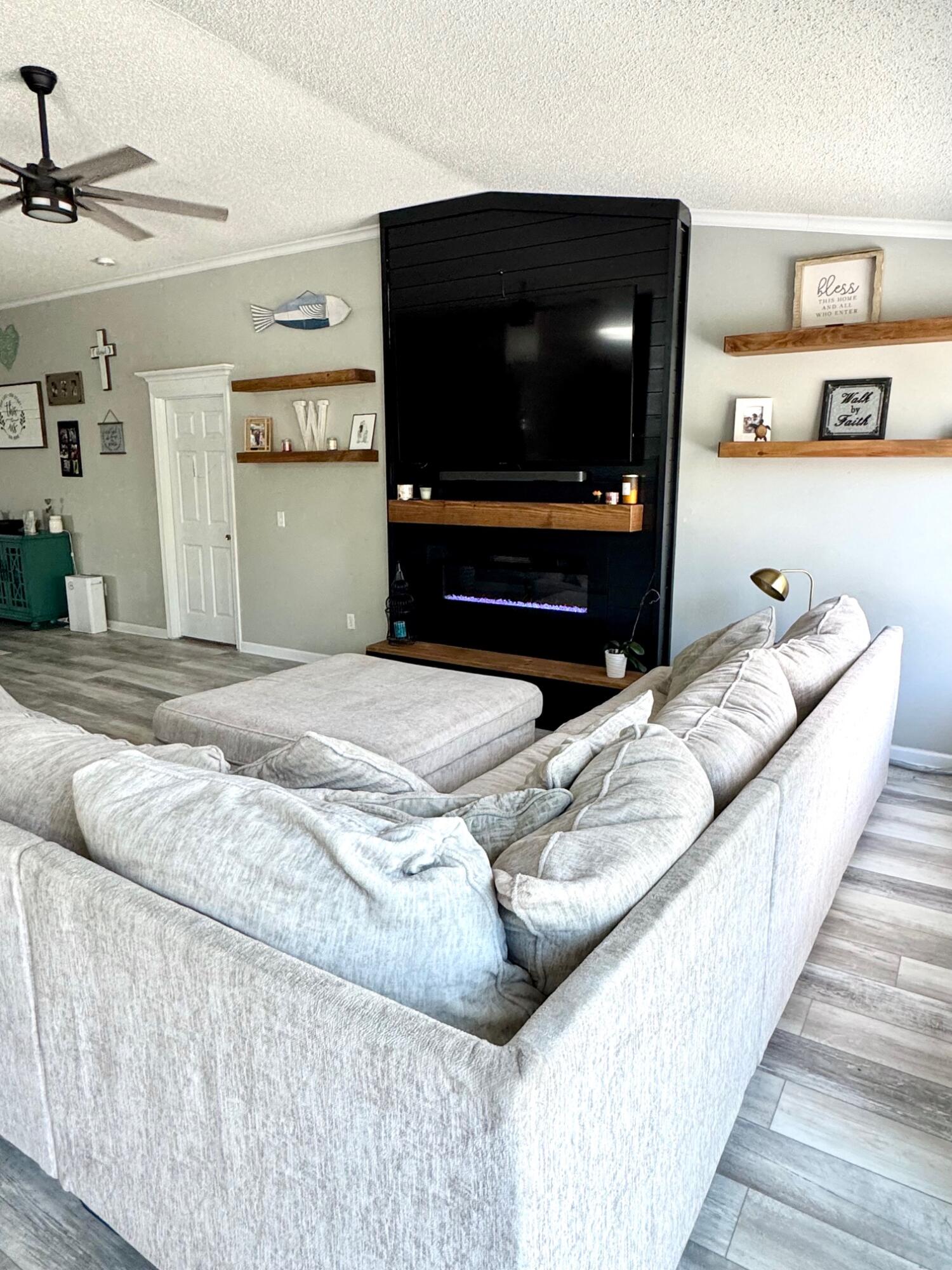 318 Peggy Drive Crestview, FL 32536 - Photo 16 of 47 a bedroom with a bed and a flat screen tv