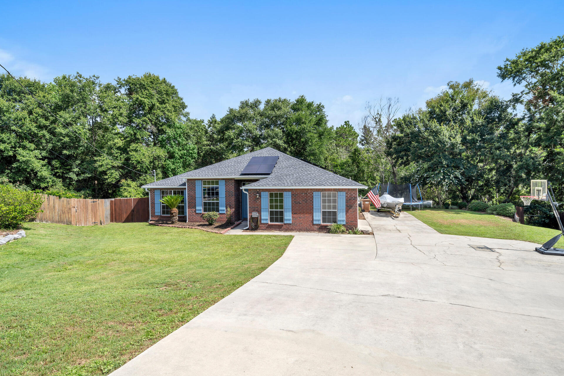 318 Peggy Drive Crestview, FL 32536 - Photo 2 of 47 a view of a house with a yard potted plants and a tree