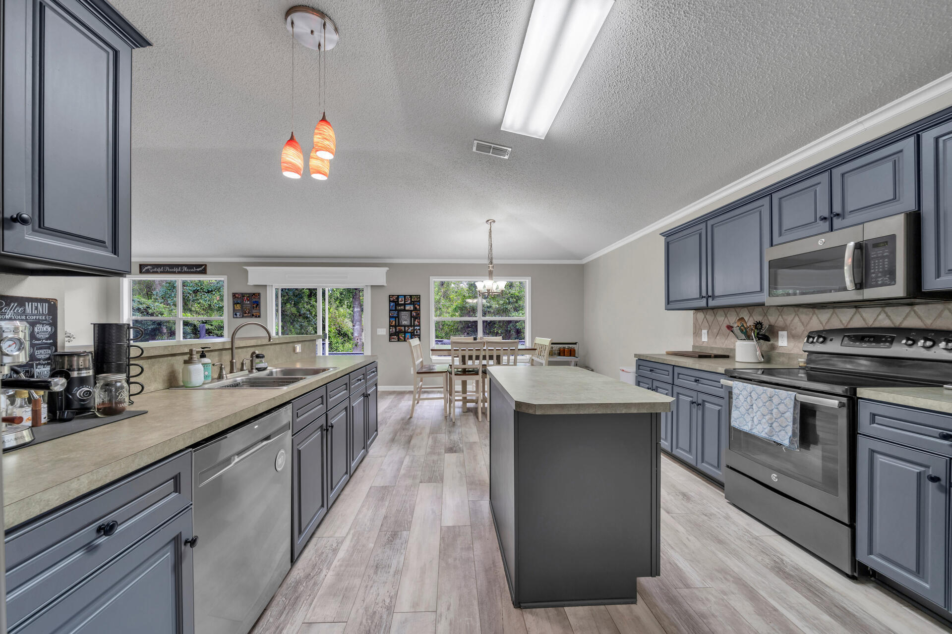 318 Peggy Drive Crestview, FL 32536 - Photo 24 of 47 a kitchen with counter top space a sink and appliances