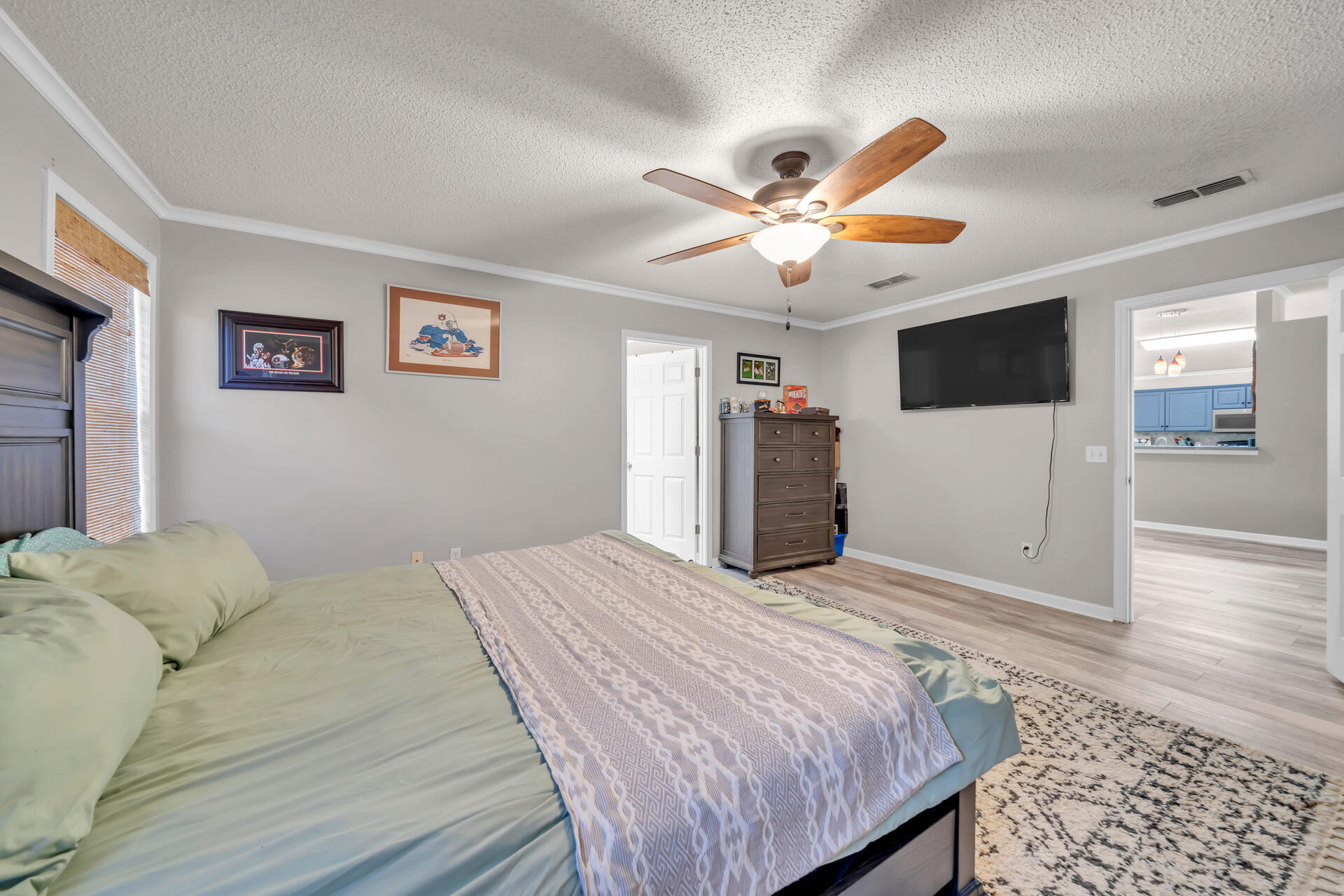 318 Peggy Drive Crestview, FL 32536 - Photo 26 of 47 a bedroom with a bed and a flat screen tv