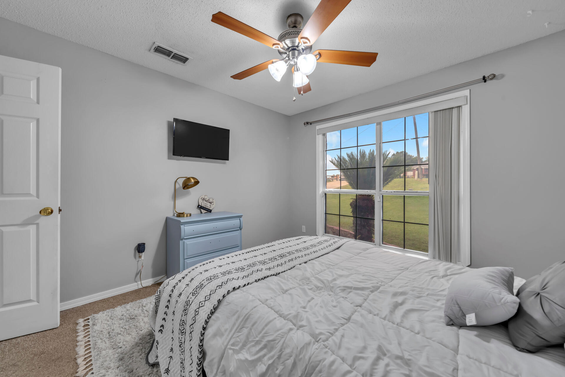 318 Peggy Drive Crestview, FL 32536 - Photo 31 of 47 a bedroom with a bed and a window