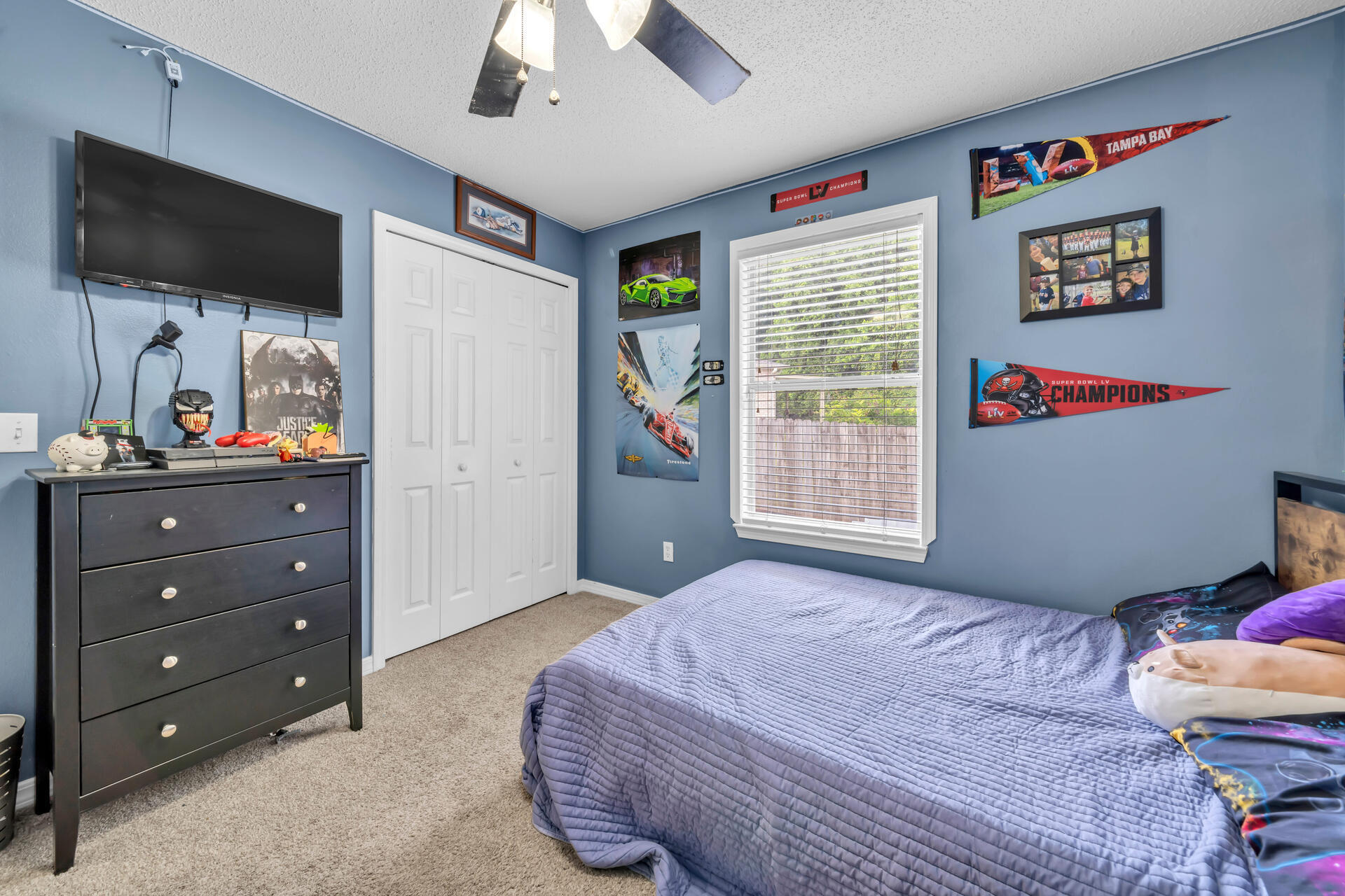 318 Peggy Drive Crestview, FL 32536 - Photo 36 of 47 a bedroom with a bed and a flat screen tv