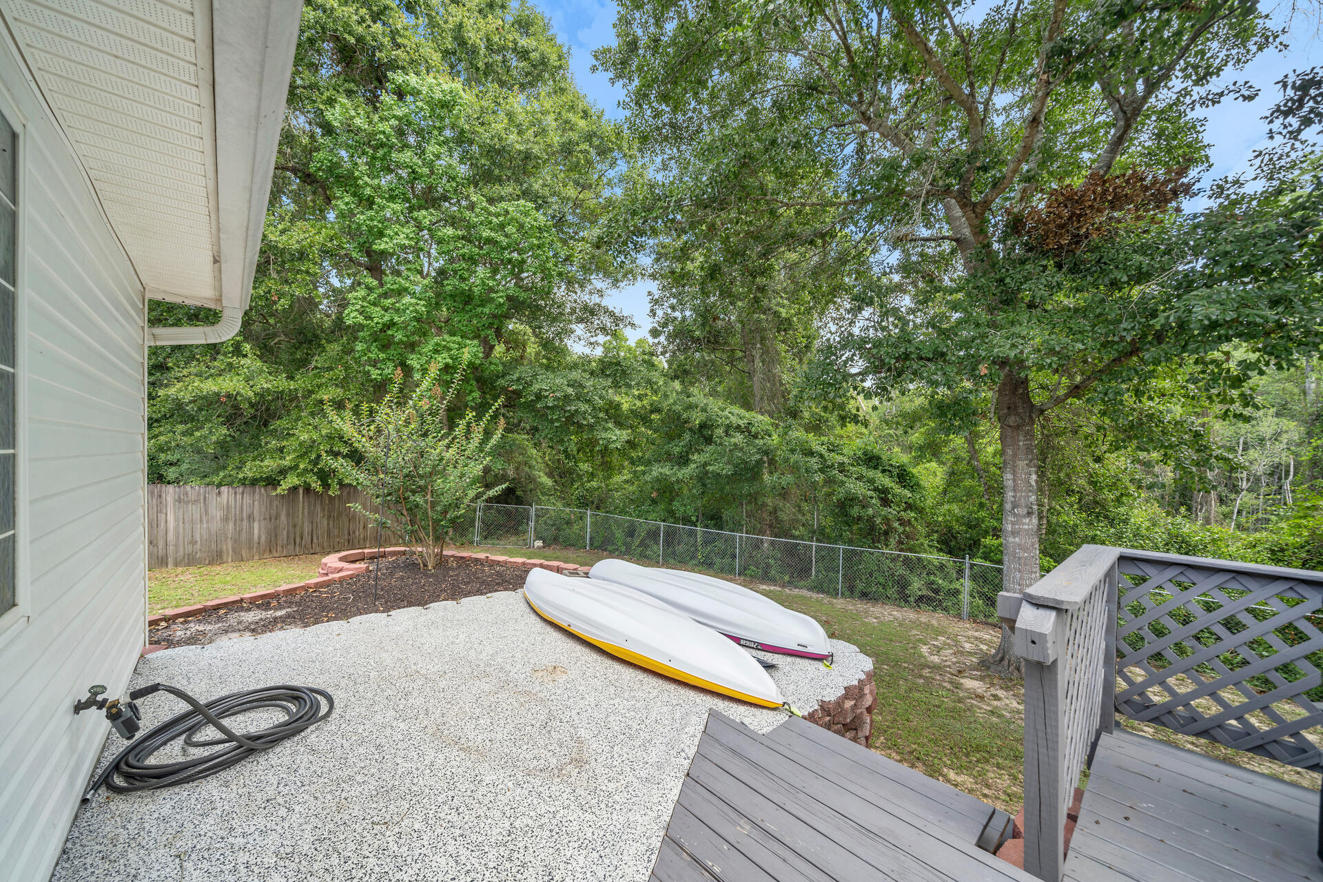 318 Peggy Drive Crestview, FL 32536 - Photo 38 of 47 a view of a roof deck with wooden floor and fence
