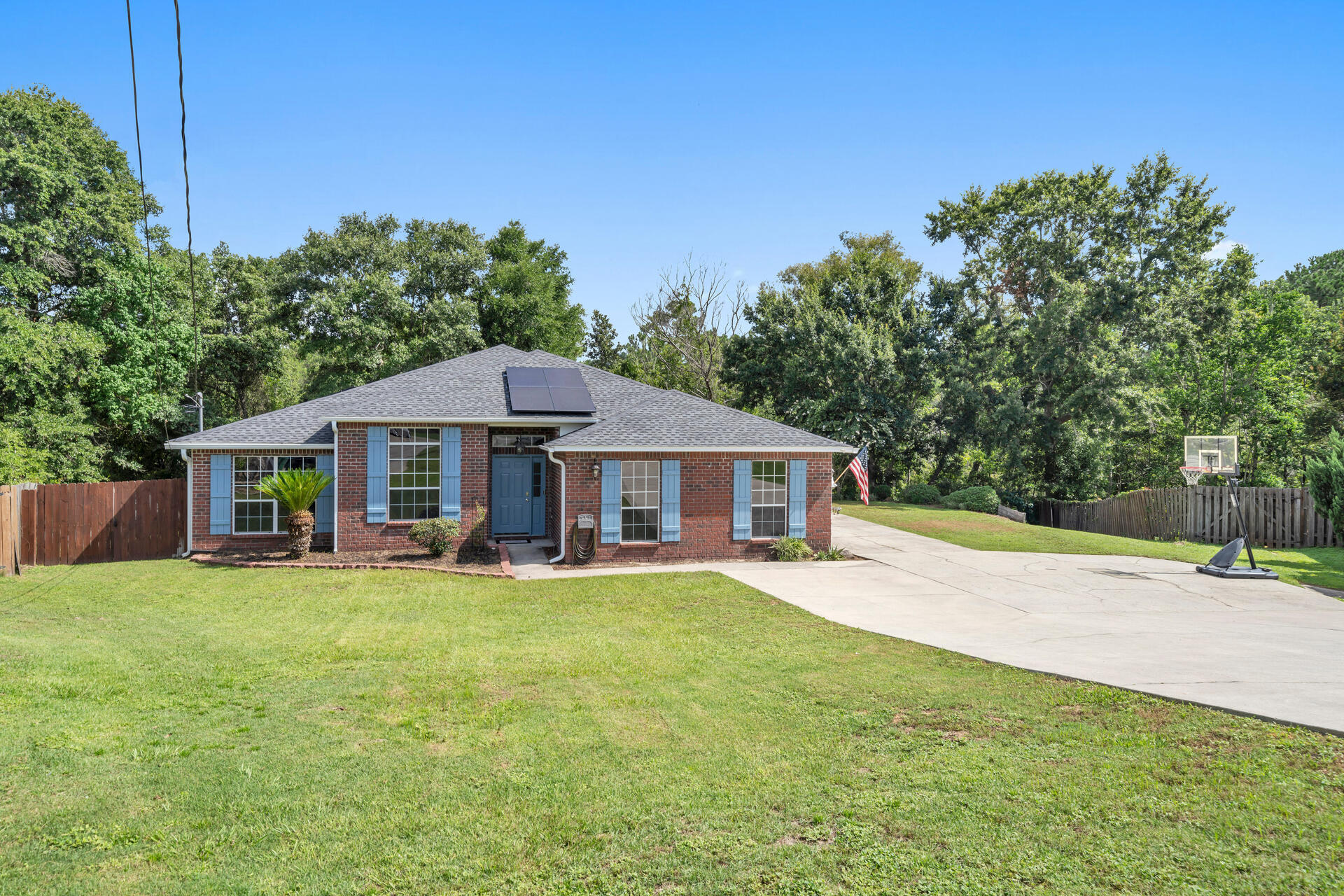 318 Peggy Drive Crestview, FL 32536 - Photo 4 of 47 a view of a house with a yard