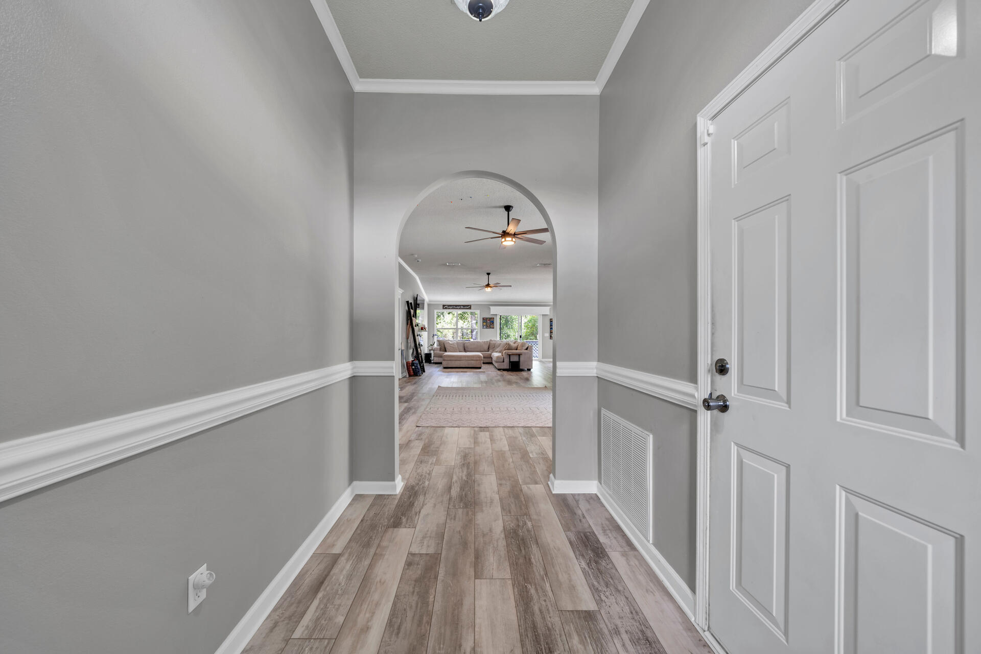 318 Peggy Drive Crestview, FL 32536 - Photo 6 of 47 a view of a hallway view with wooden floor and staircase