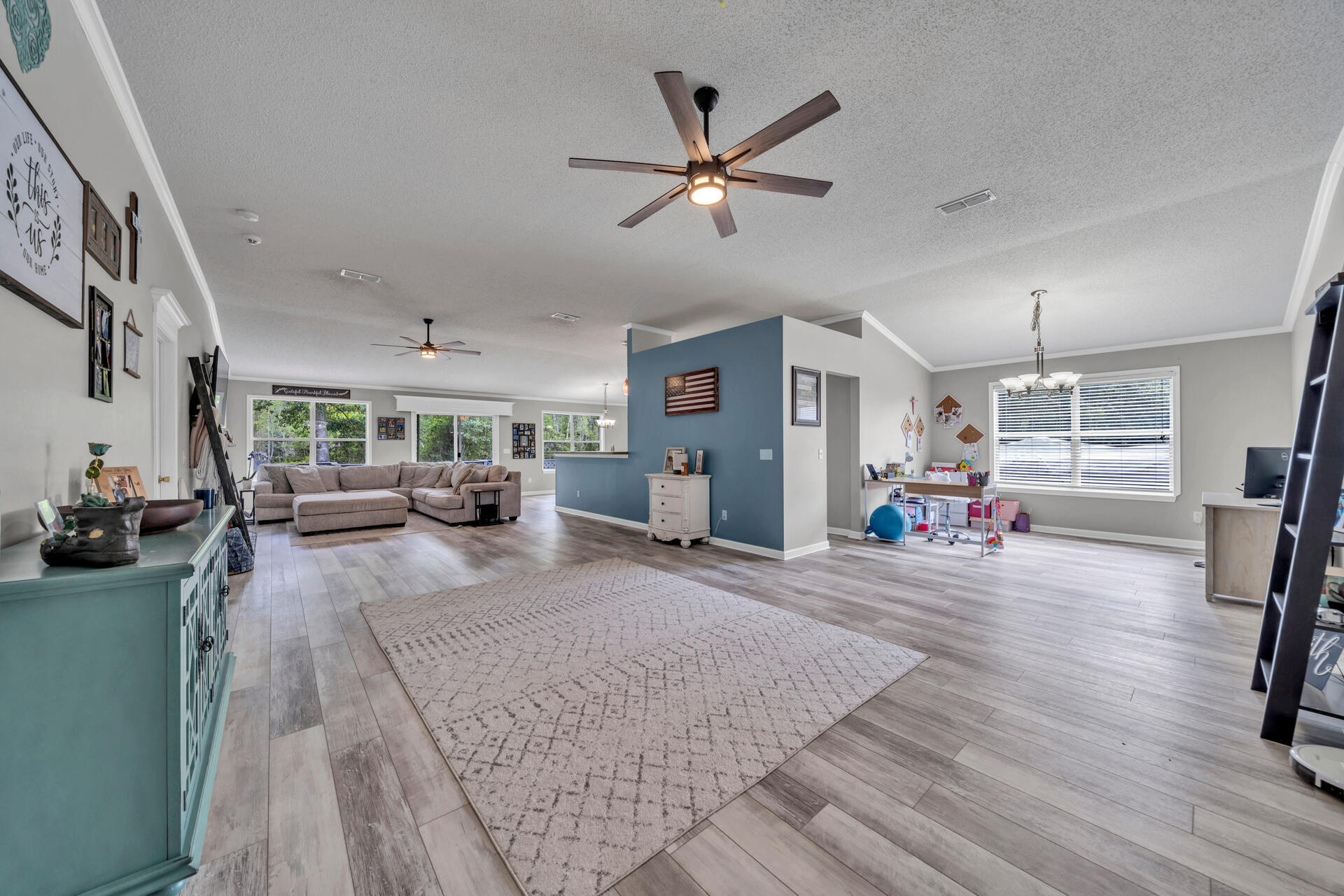 318 Peggy Drive Crestview, FL 32536 - Photo 7 of 47 a living room with furniture and a wooden floor