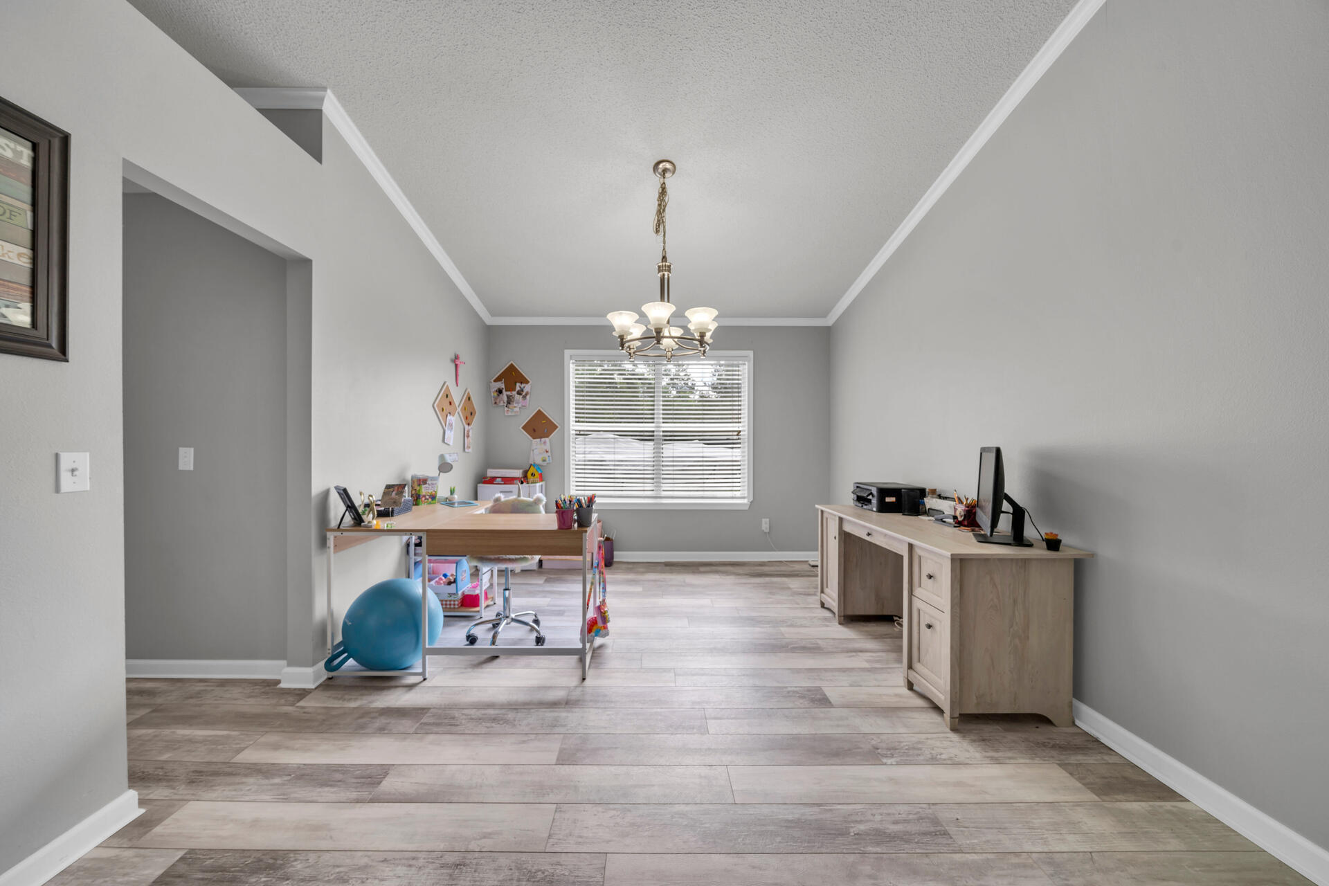 318 Peggy Drive Crestview, FL 32536 - Photo 8 of 47 a living room with furniture and a chandelier