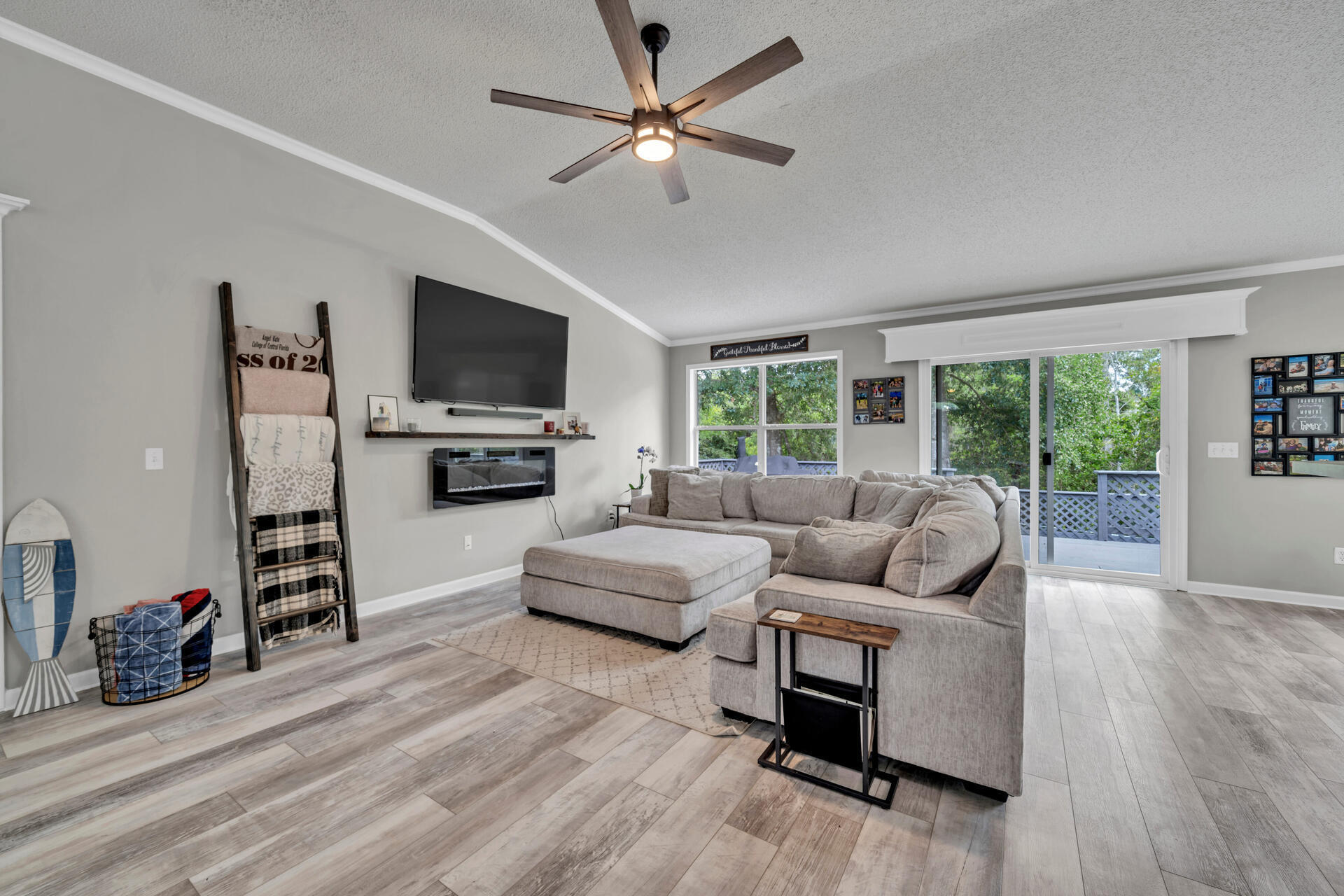 318 Peggy Drive Crestview, FL 32536 - Photo 10 of 47 a living room with furniture and a flat screen tv
