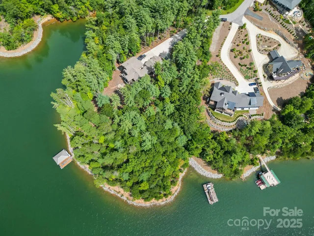 an aerial view of a house with a swimming pool