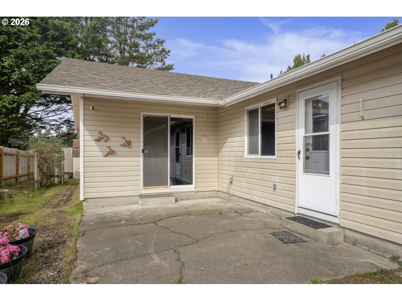 1960 40th Street Florence, OR 97439 - Photo 42 of 48 a view of a house with a patio