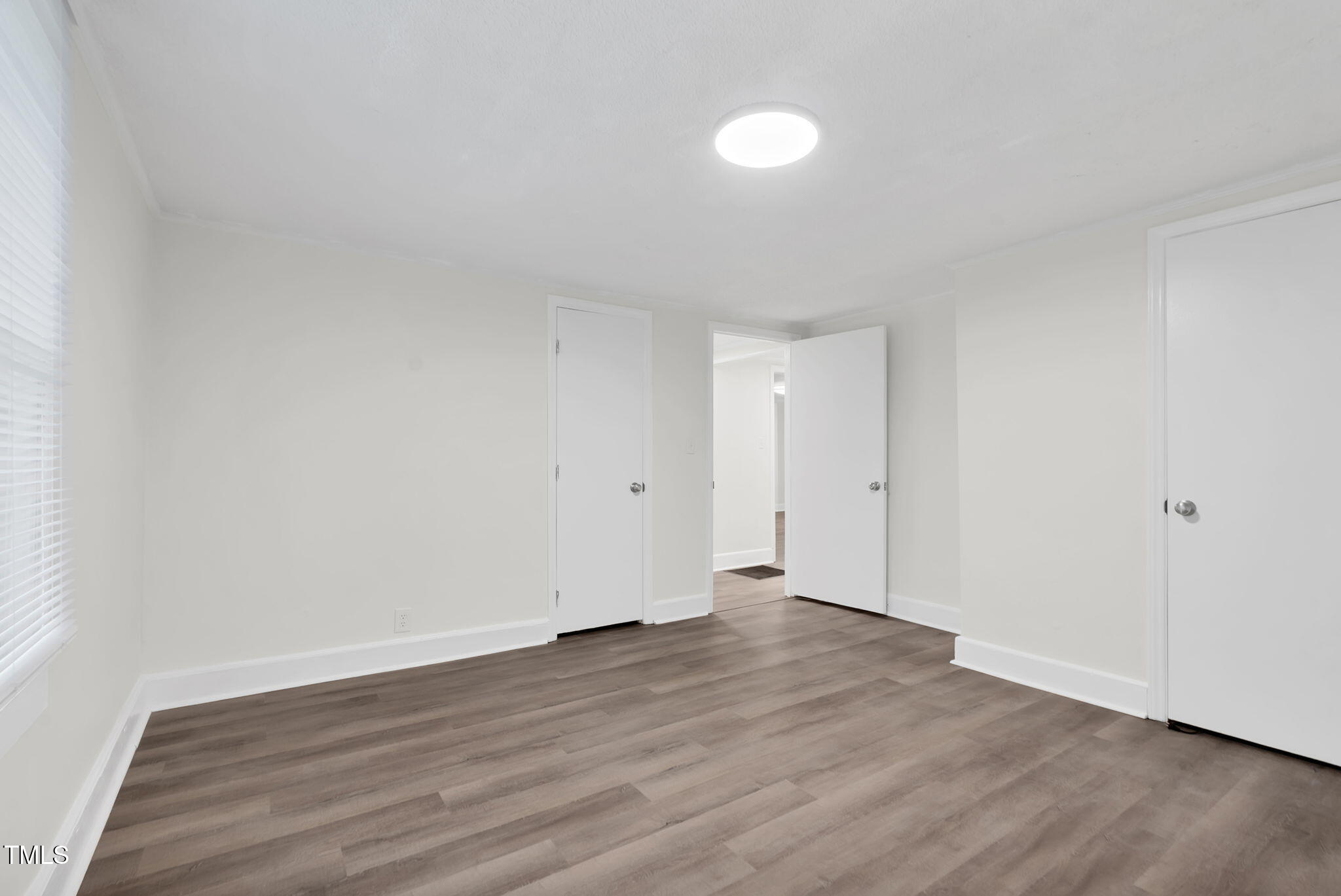 313 West Church Street Angier, NC 27501 - Photo 26 of 39 a view of an empty room with wooden floor